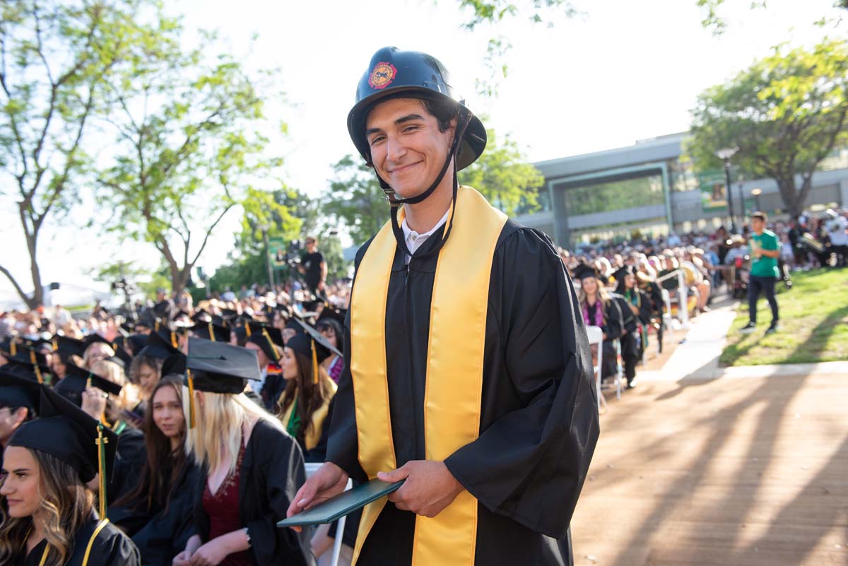 Students receive diploma covers at CHC Commencement 2025.