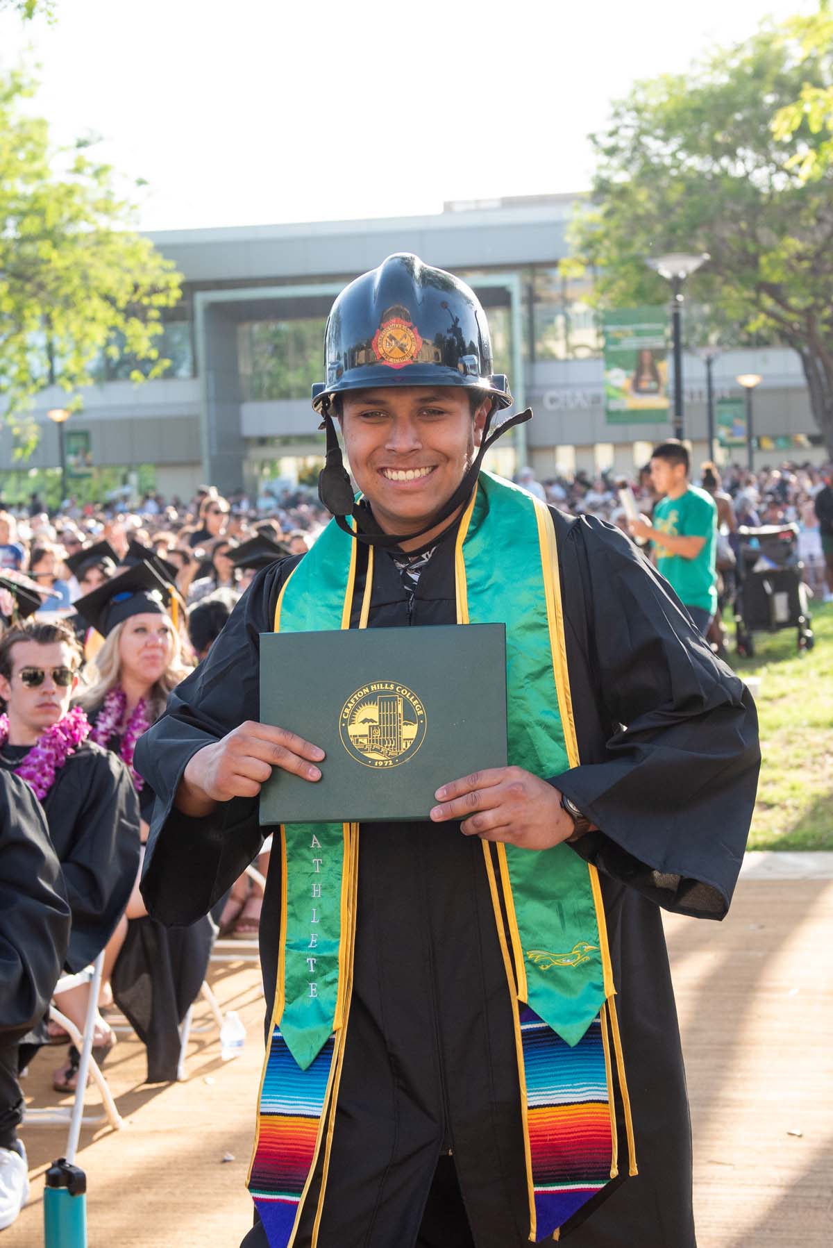 Students receive diploma covers at CHC Commencement 2025.