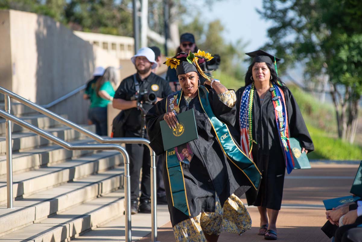 Students receive diploma covers at CHC Commencement 2025.