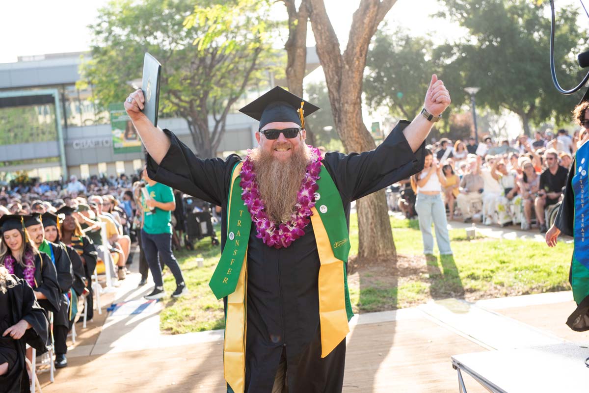 Students receive diploma covers at CHC Commencement 2025.