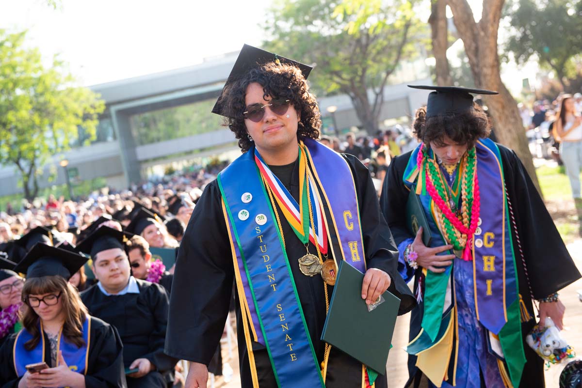 Students receive diploma covers at CHC Commencement 2025.