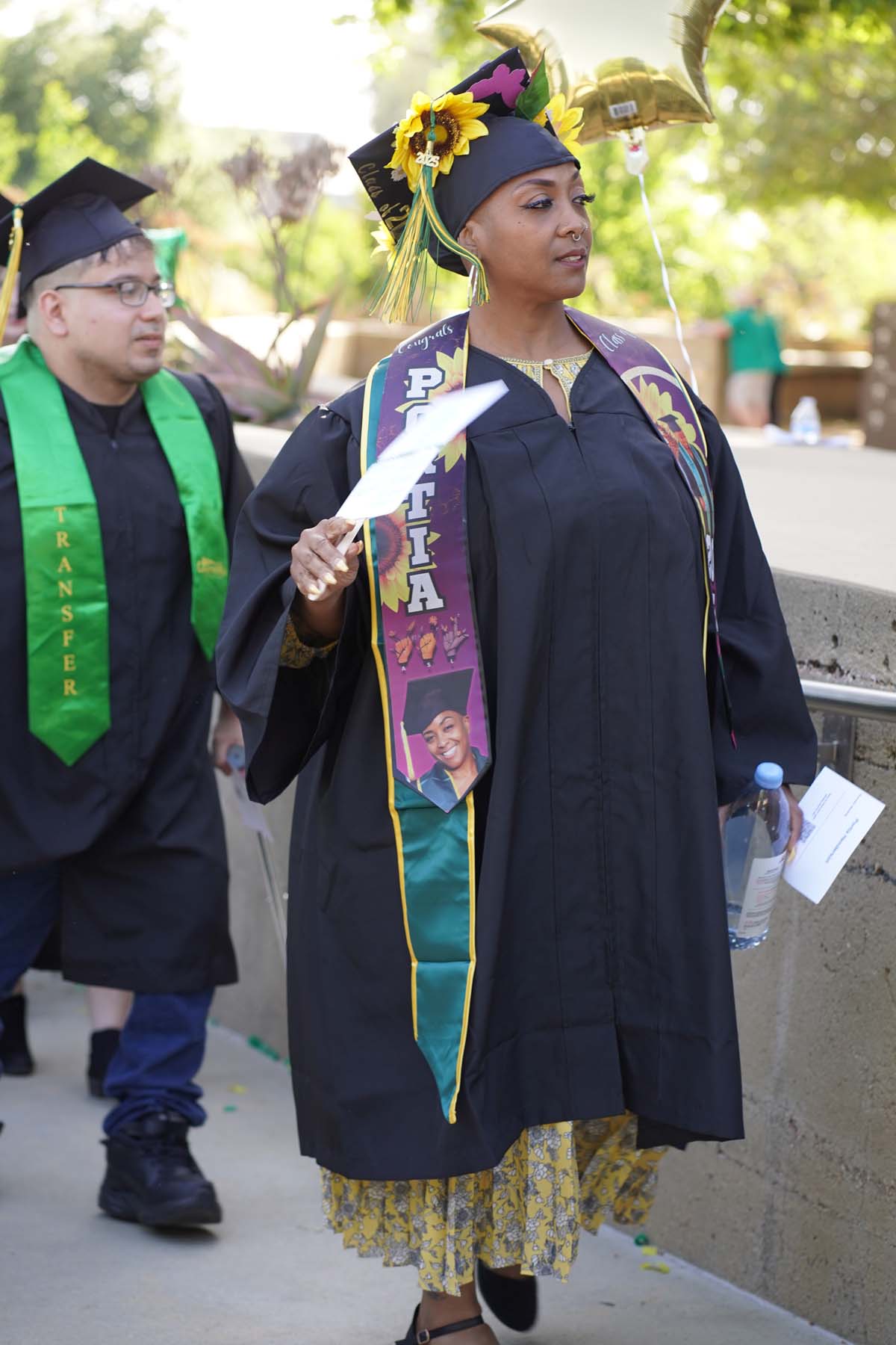 Students receive diploma covers at CHC Commencement 2025.