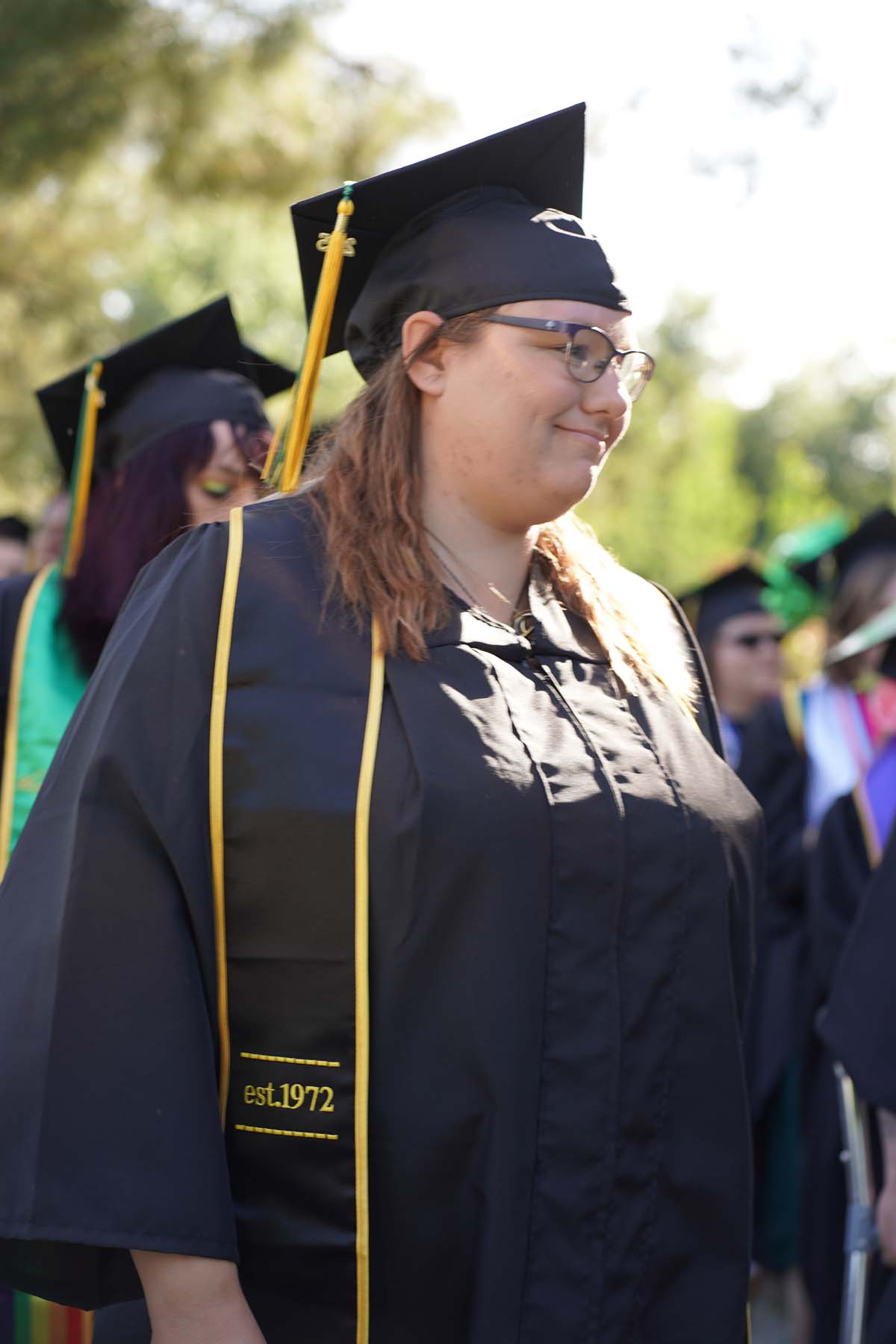 Students receive diploma covers at CHC Commencement 2025.