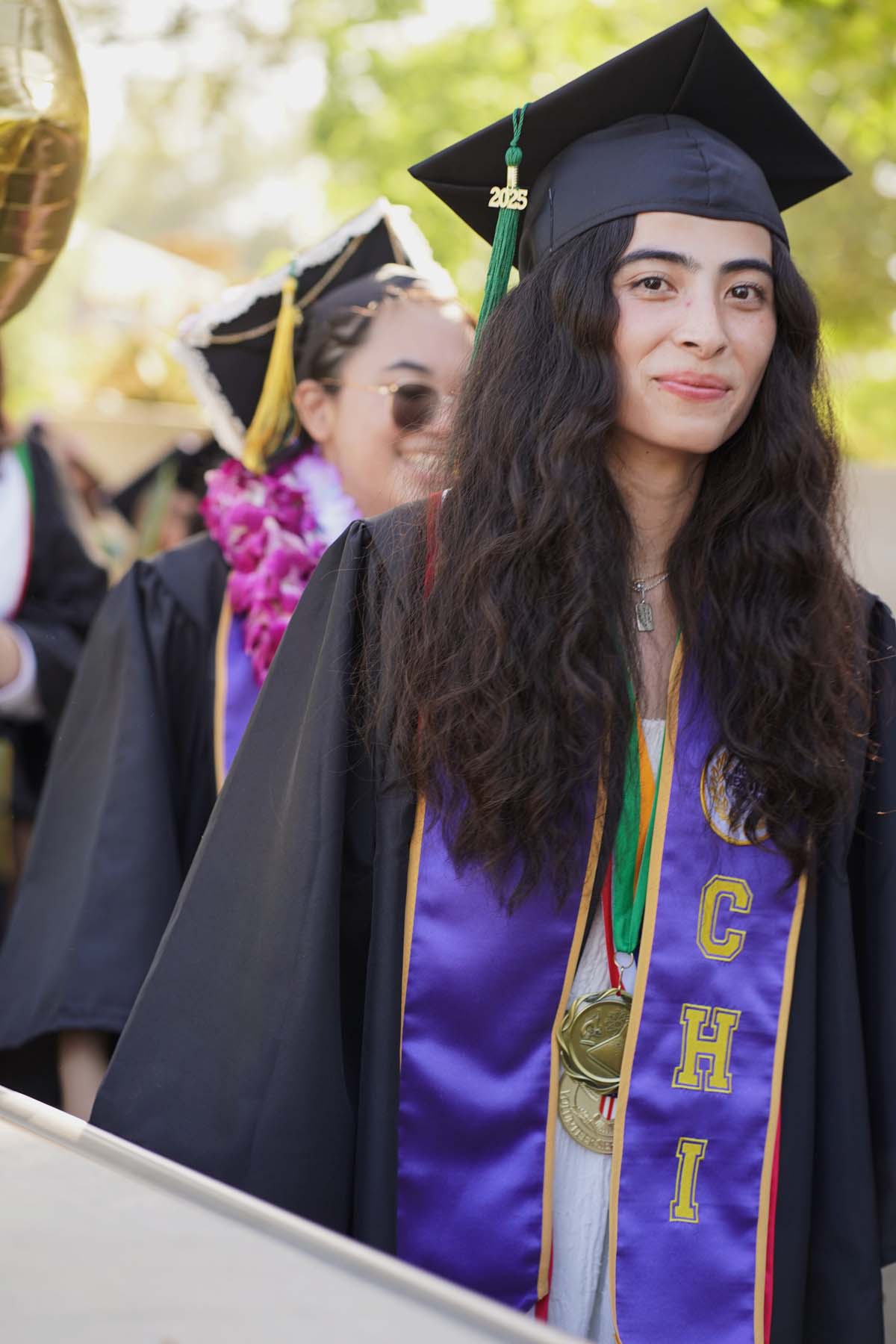 Students receive diploma covers at CHC Commencement 2025.