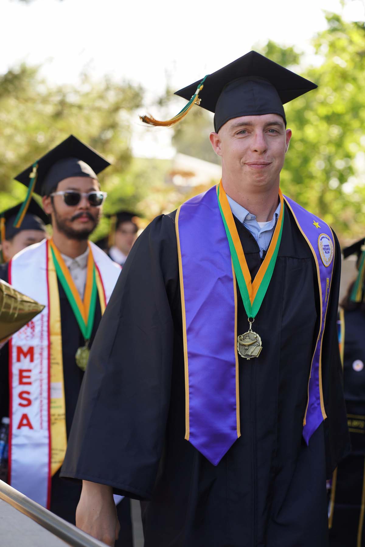 Students receive diploma covers at CHC Commencement 2025.