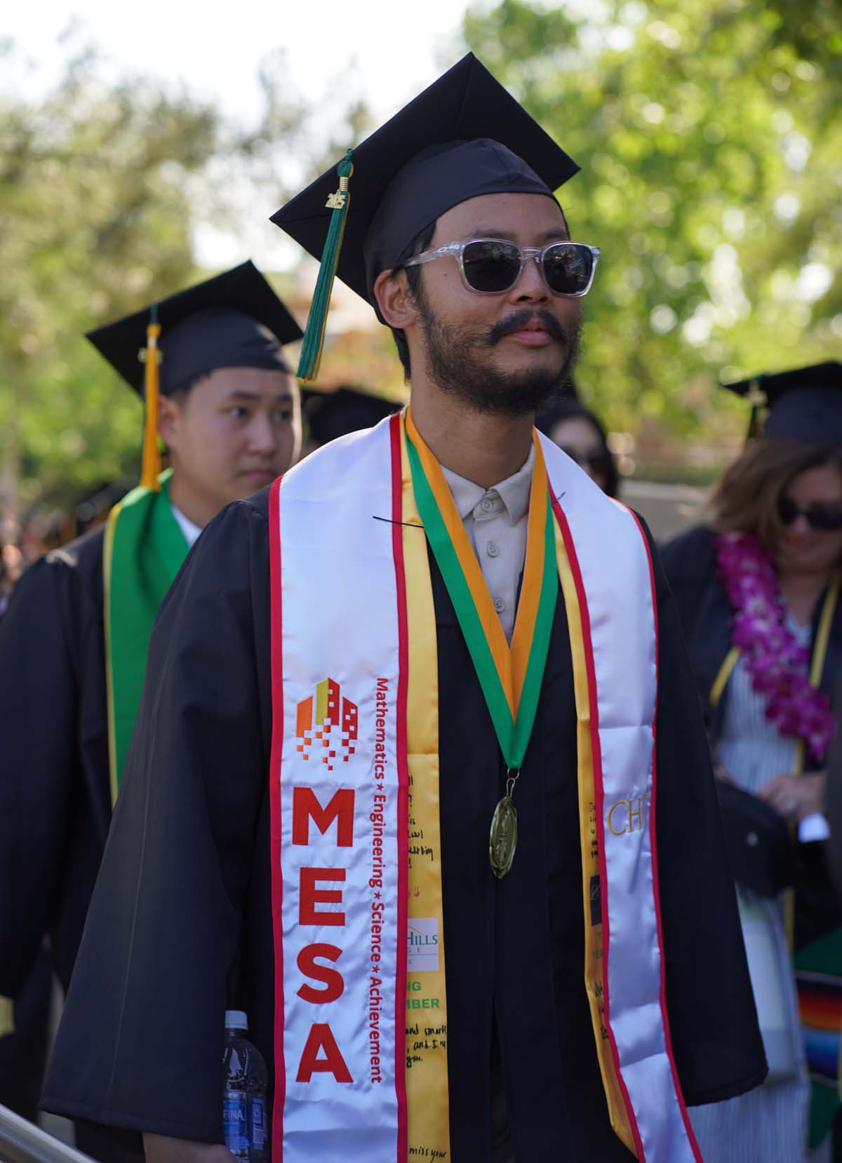 Students receive diploma covers at CHC Commencement 2025.