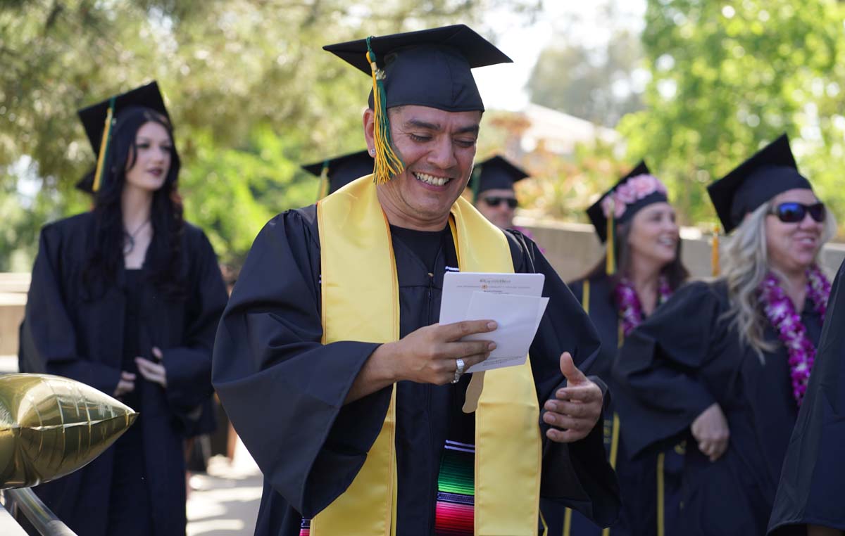 Students receive diploma covers at CHC Commencement 2025.