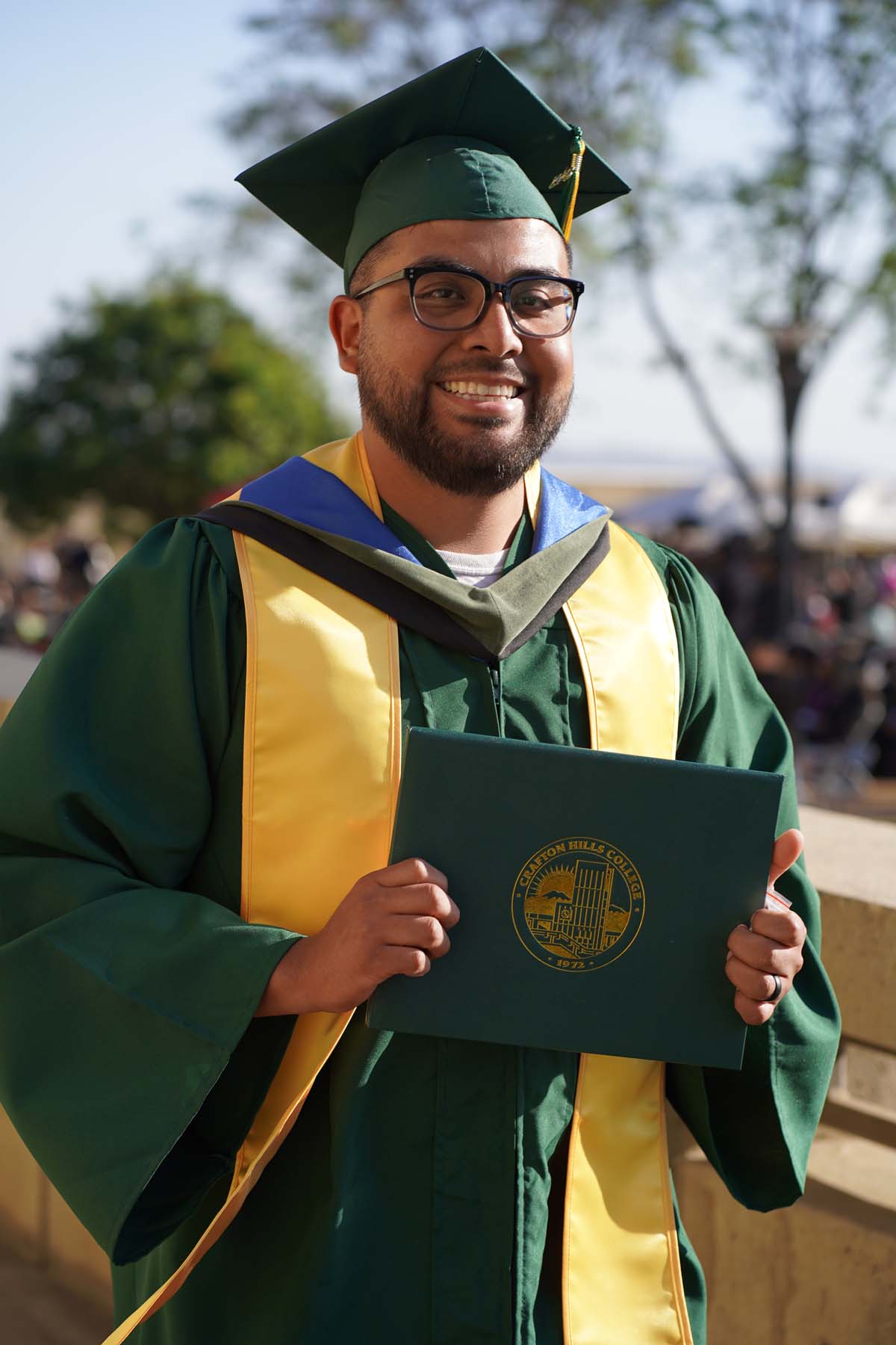 Students receive diploma covers at CHC Commencement 2025.