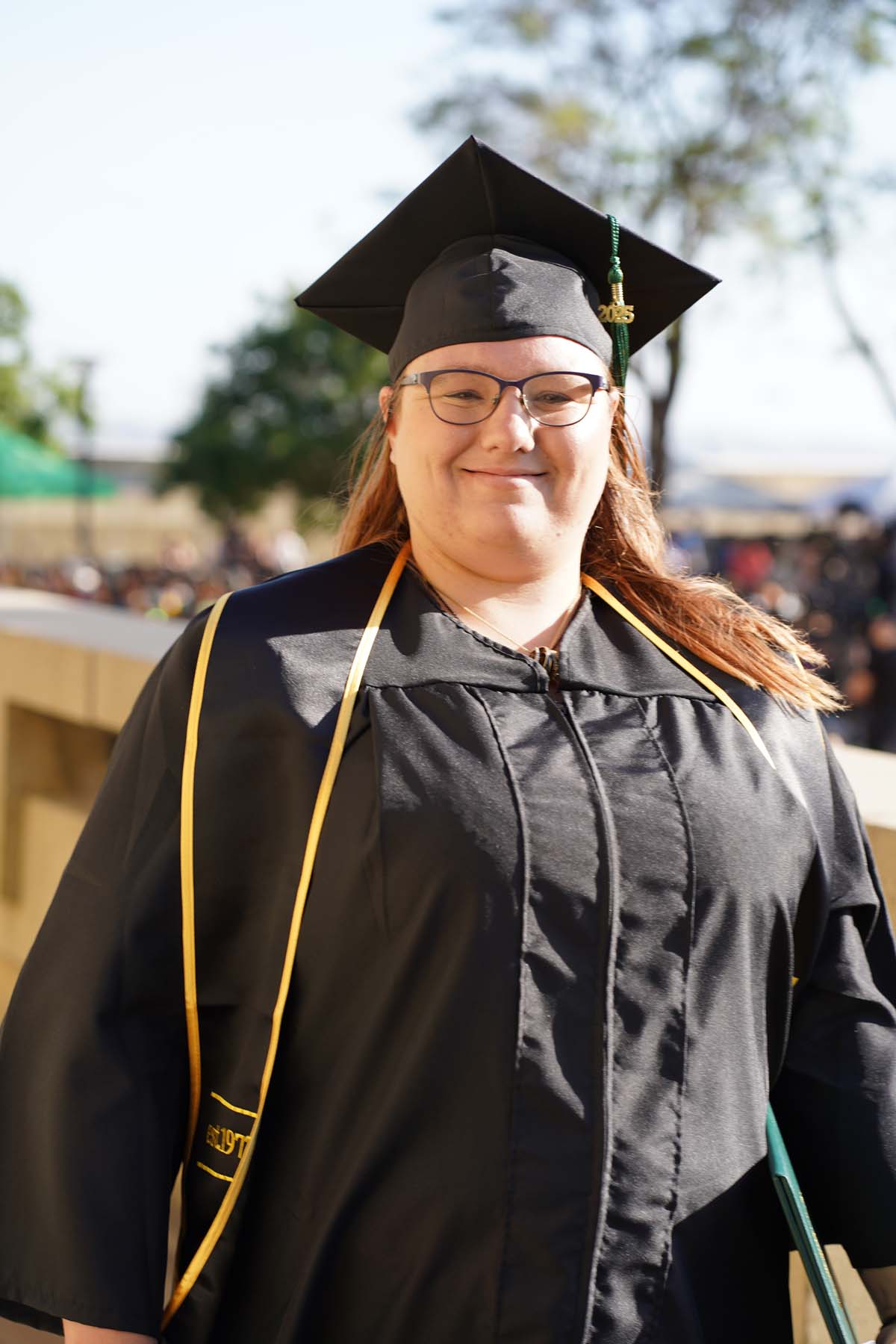 Students receive diploma covers at CHC Commencement 2025.