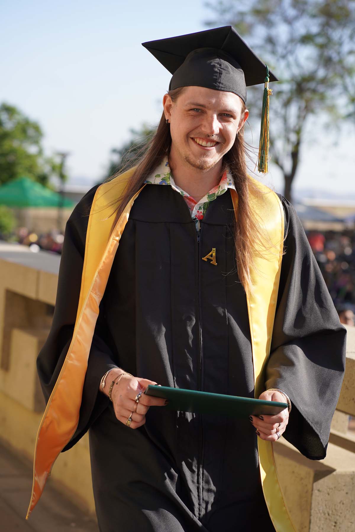 Students receive diploma covers at CHC Commencement 2025.