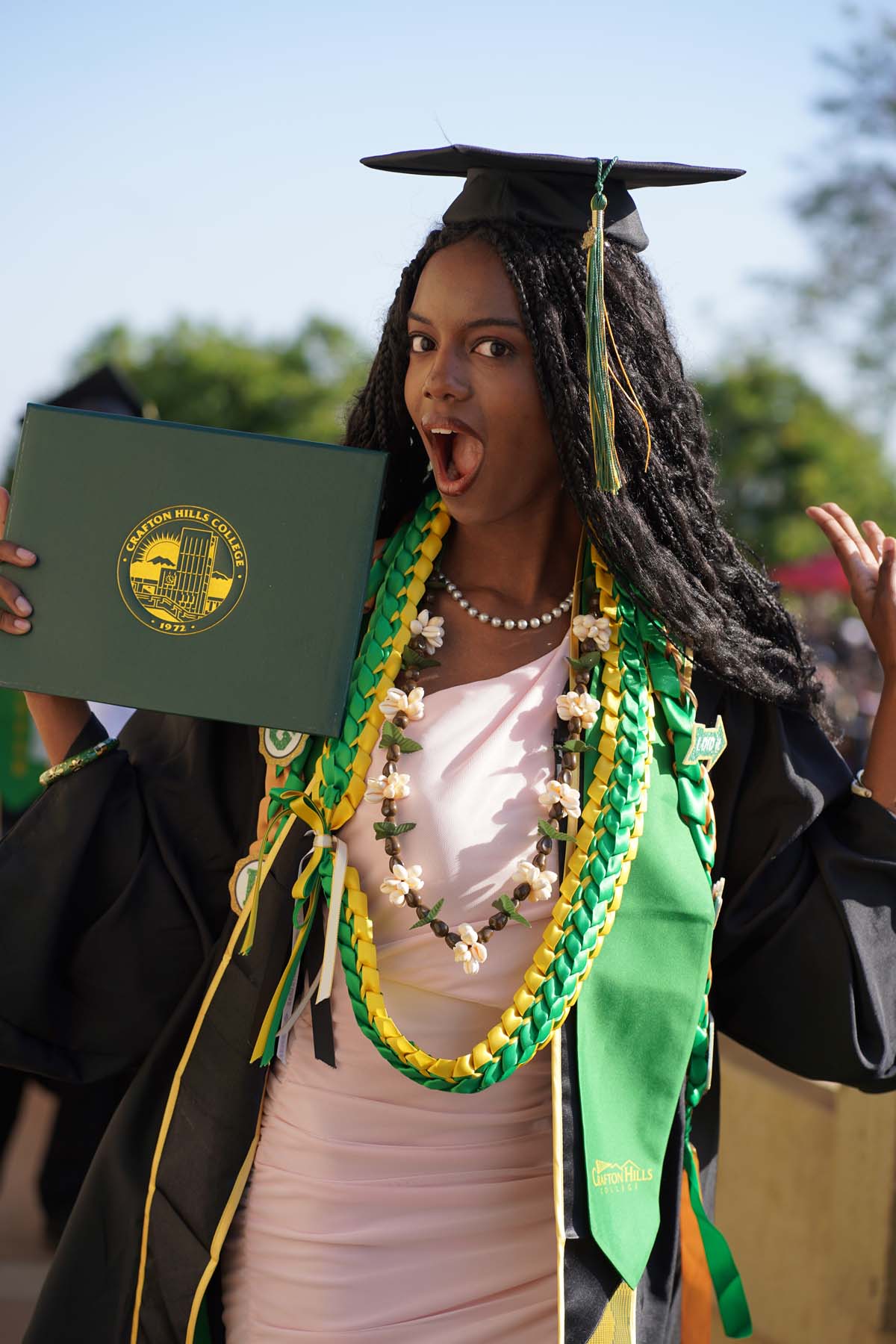 Students receive diploma covers at CHC Commencement 2025.