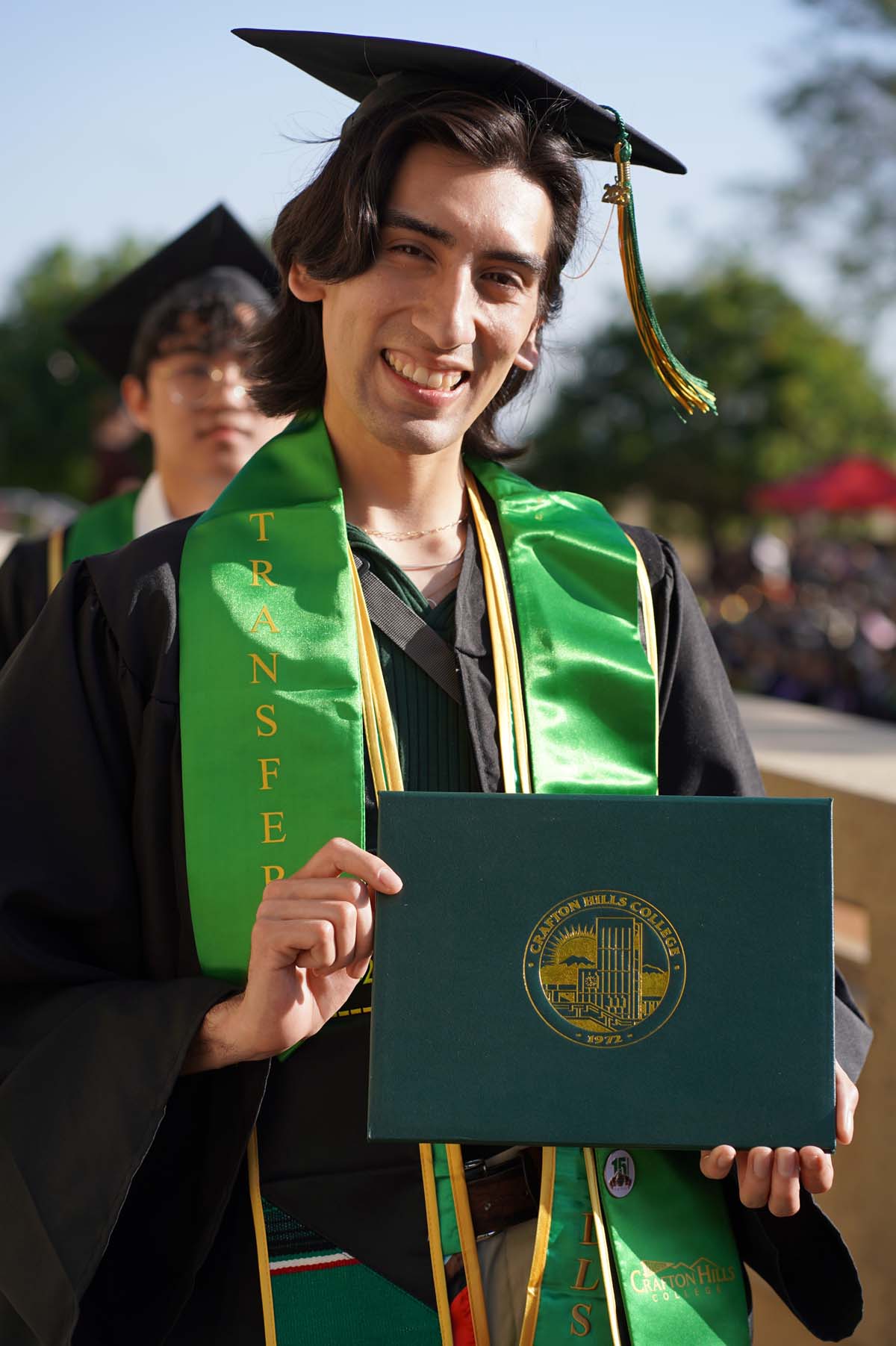 Students receive diploma covers at CHC Commencement 2025.