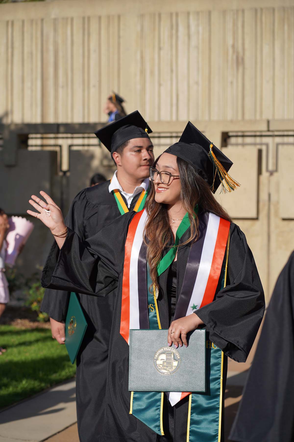 Students receive diploma covers at CHC Commencement 2025.