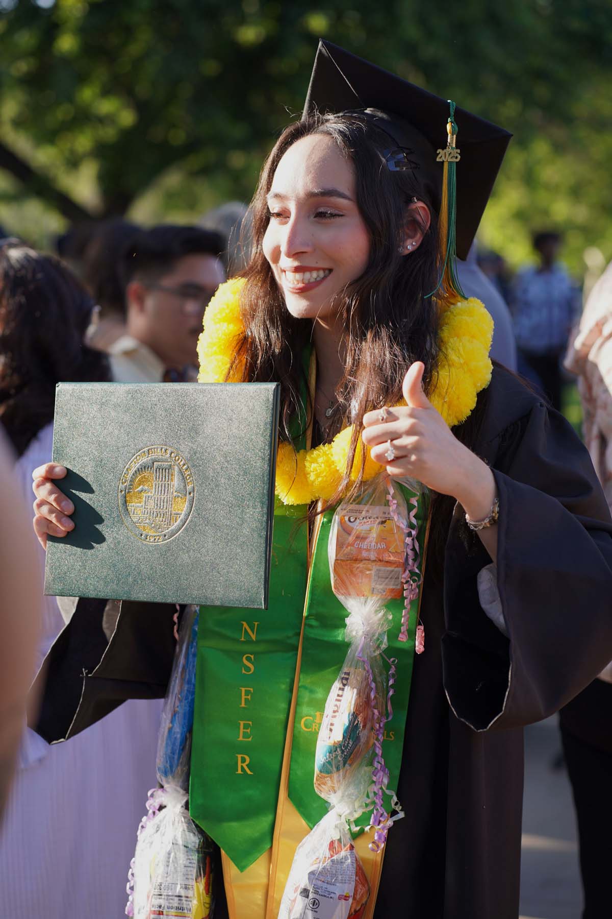 Students receive diploma covers at CHC Commencement 2025.