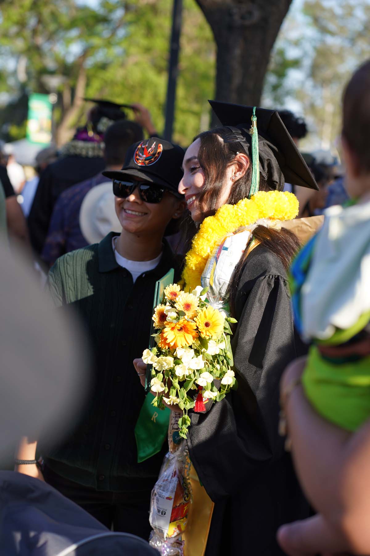 Grad recession at Commencement 2025 and pictures with family members.