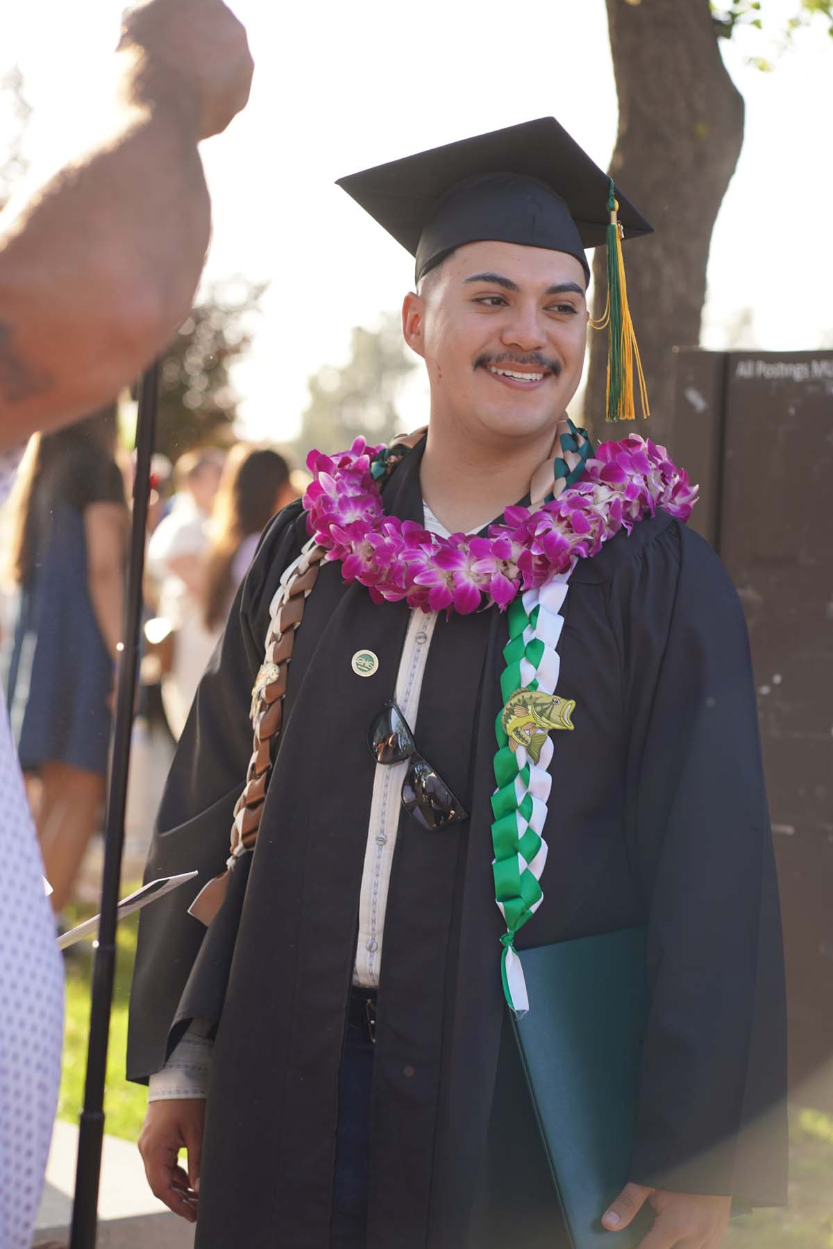 Grad recession at Commencement 2025 and pictures with family members.