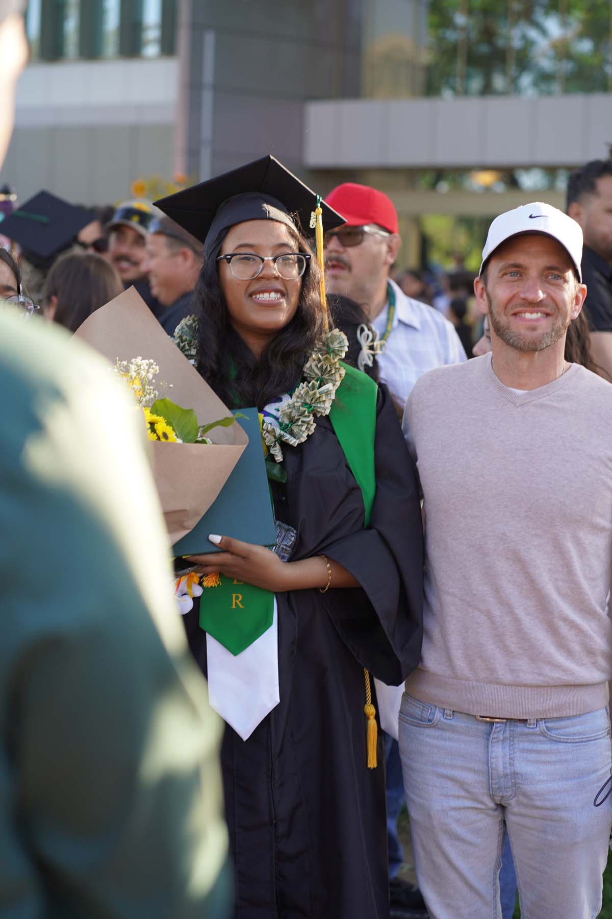 Grad recession at Commencement 2025 and pictures with family members.