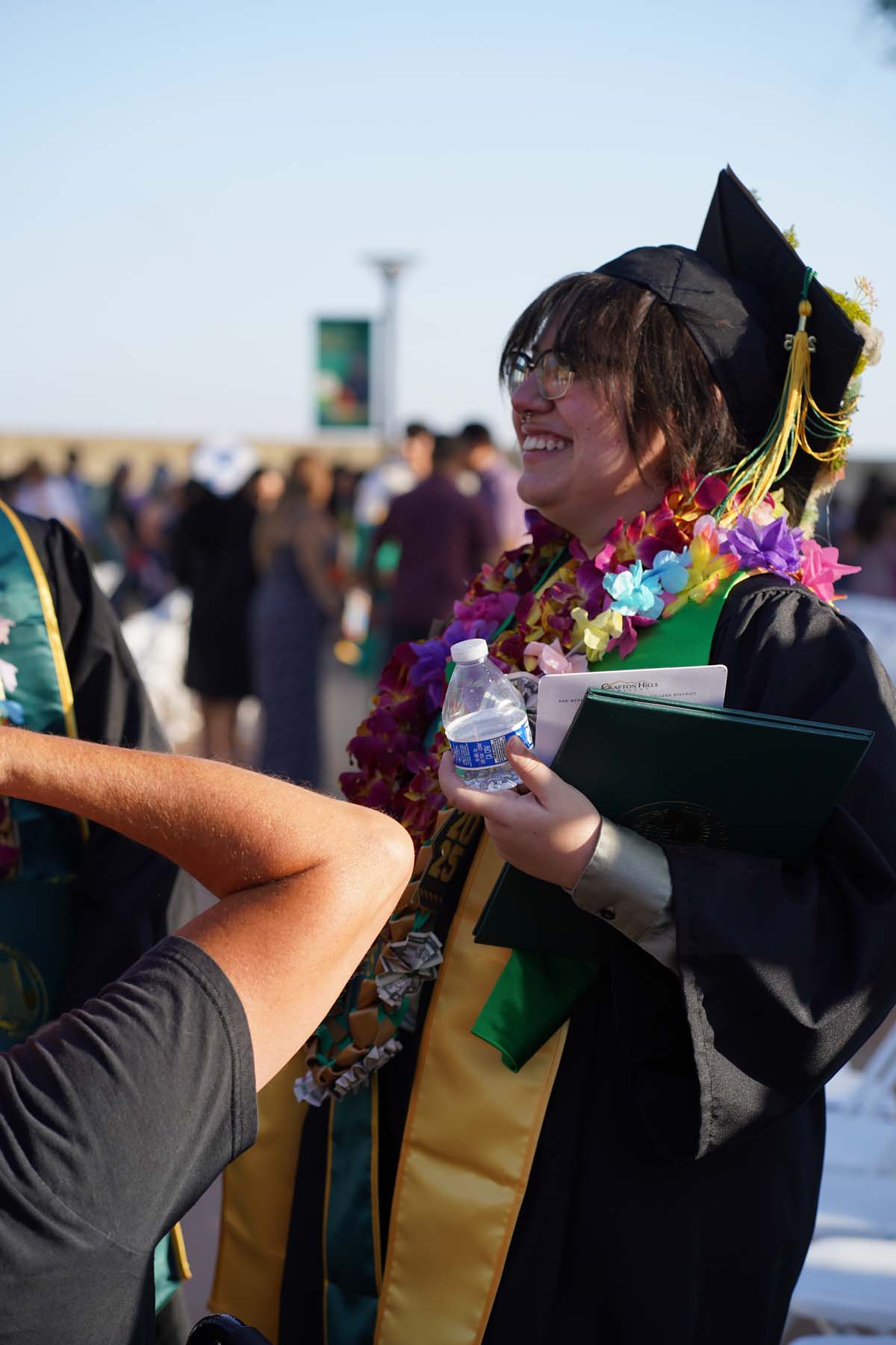 Grad recession at Commencement 2025 and pictures with family members.