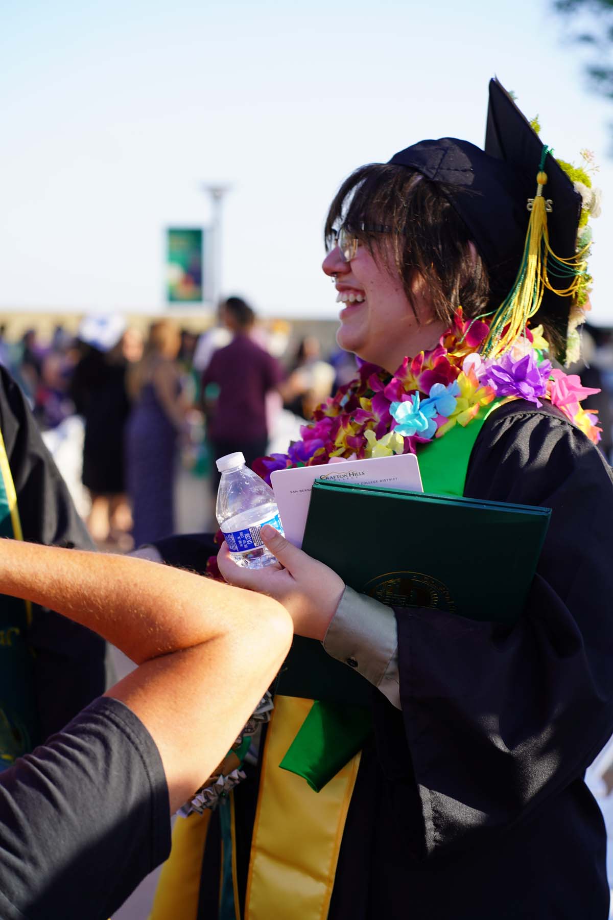Grad recession at Commencement 2025 and pictures with family members.
