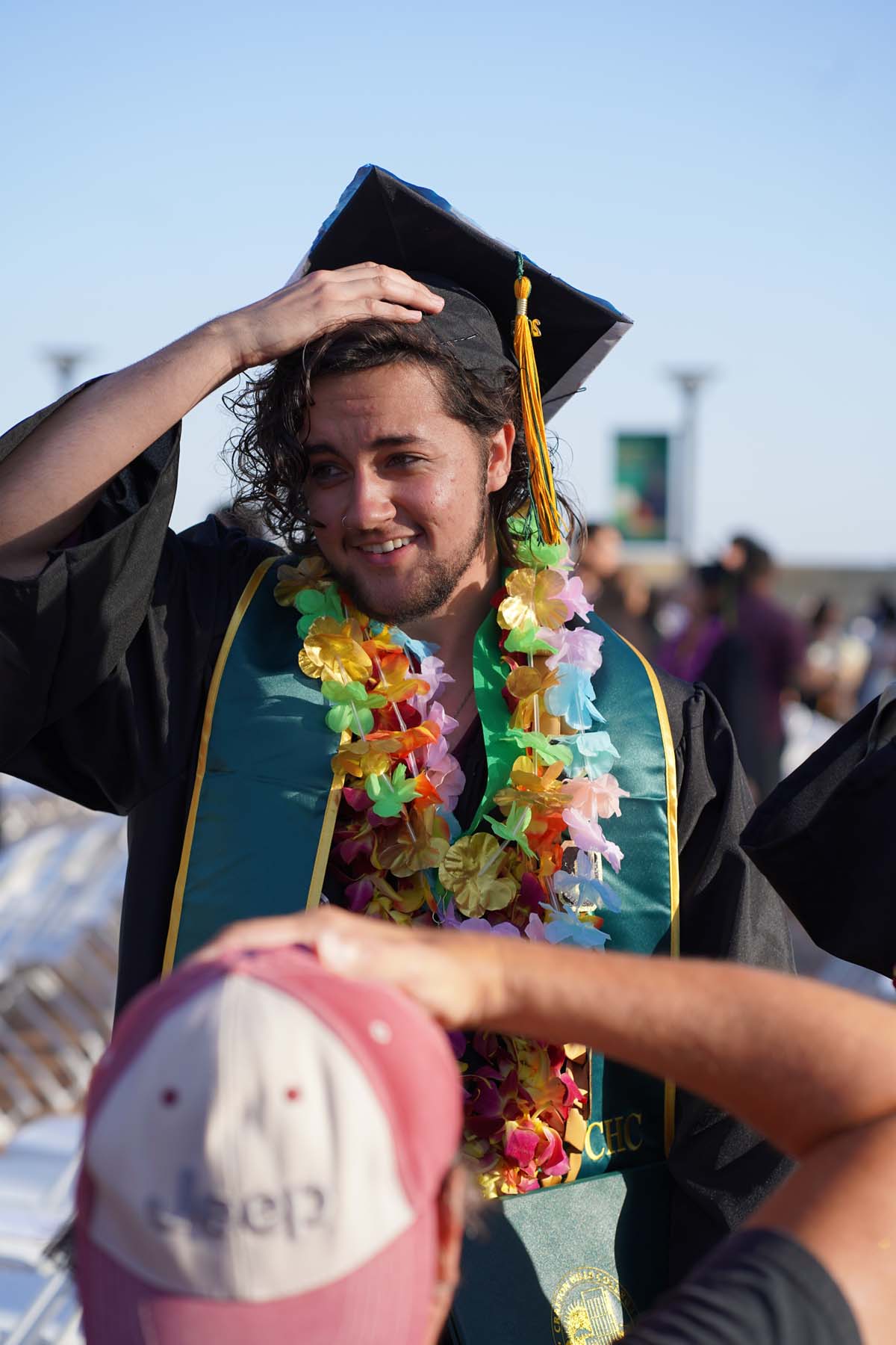 Grad recession at Commencement 2025 and pictures with family members.