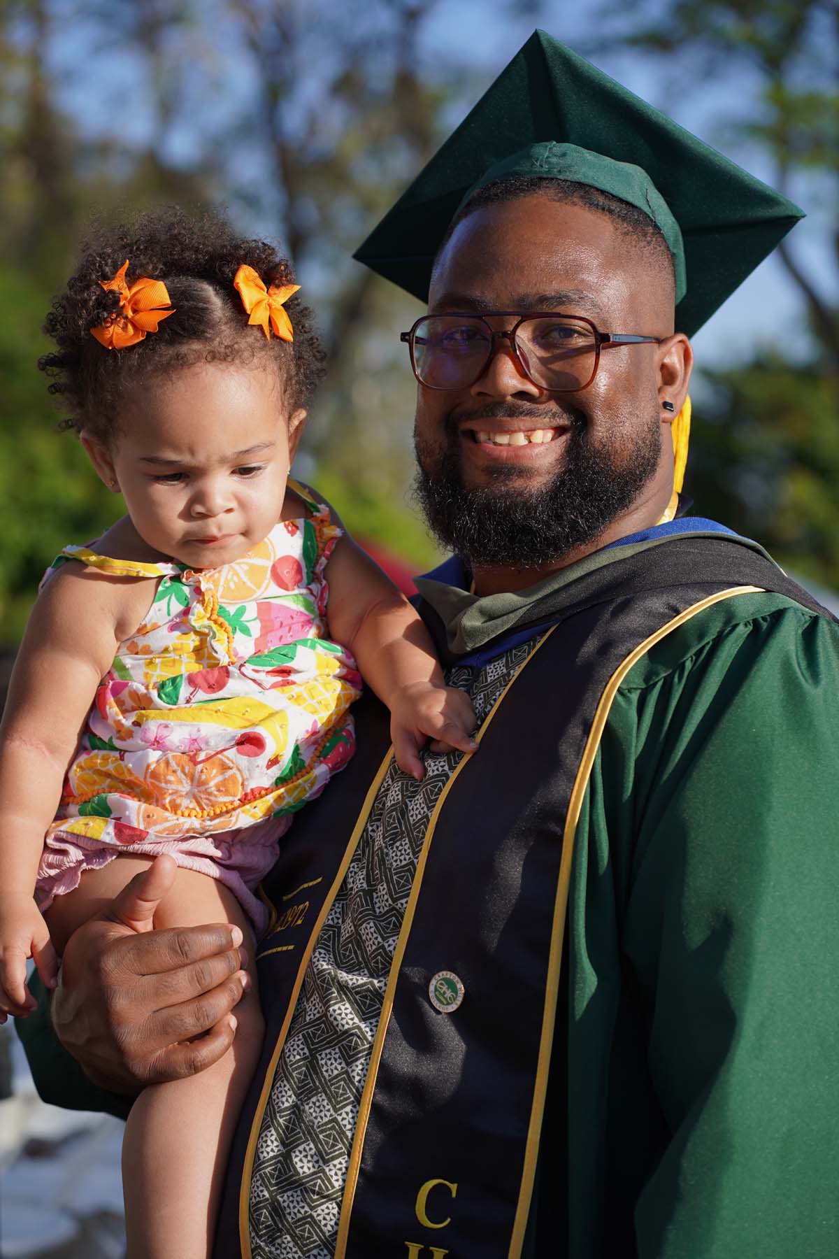 Grad recession at Commencement 2025 and pictures with family members.