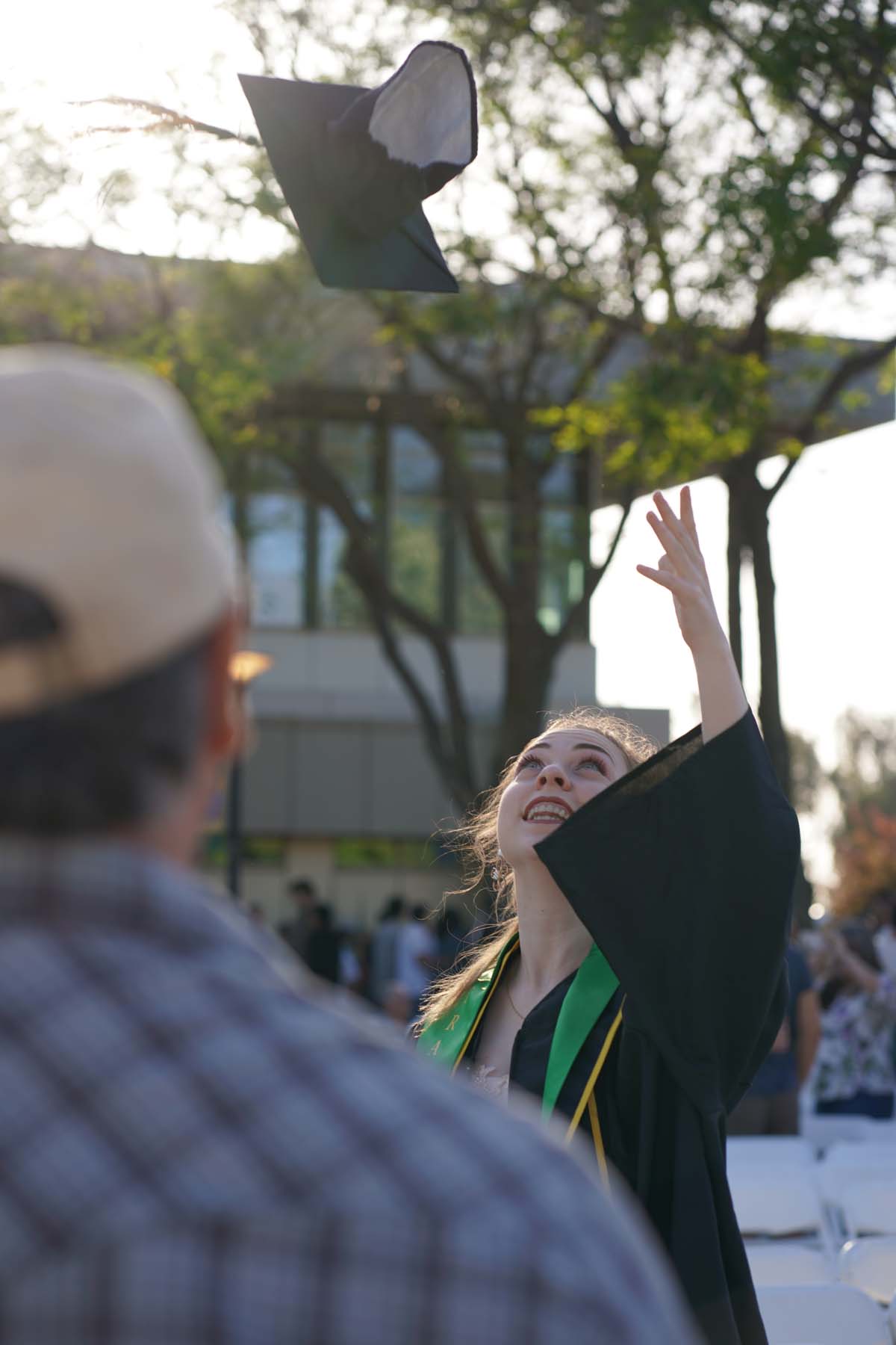 Grad recession at Commencement 2025 and pictures with family members.