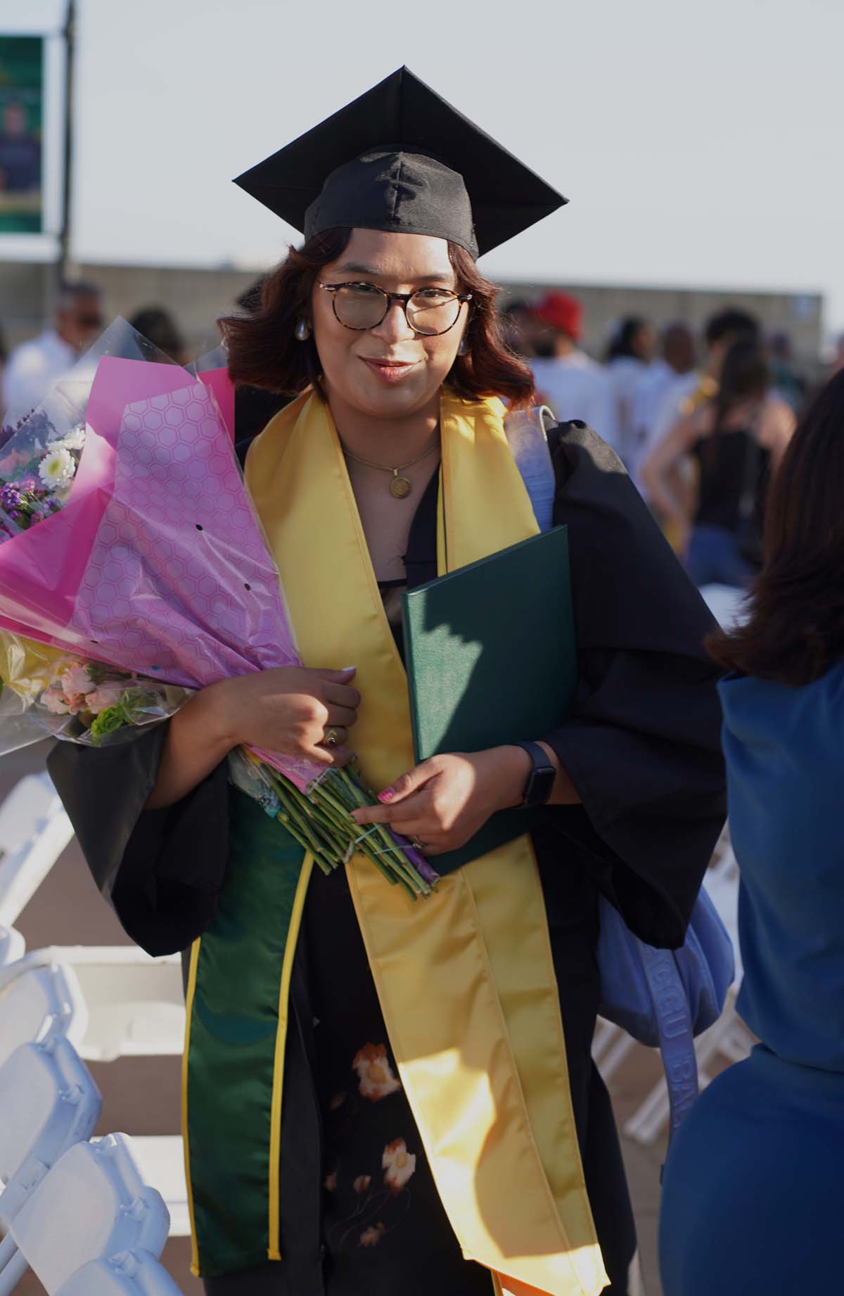 Grad recession at Commencement 2025 and pictures with family members.