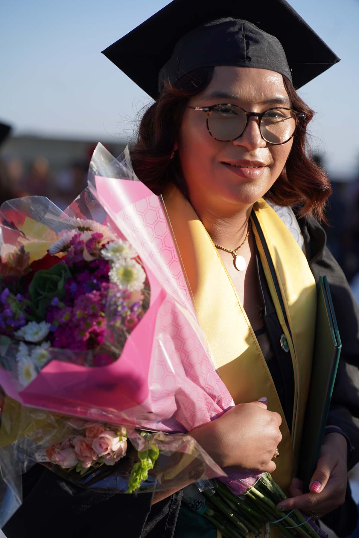 Grad recession at Commencement 2025 and pictures with family members.