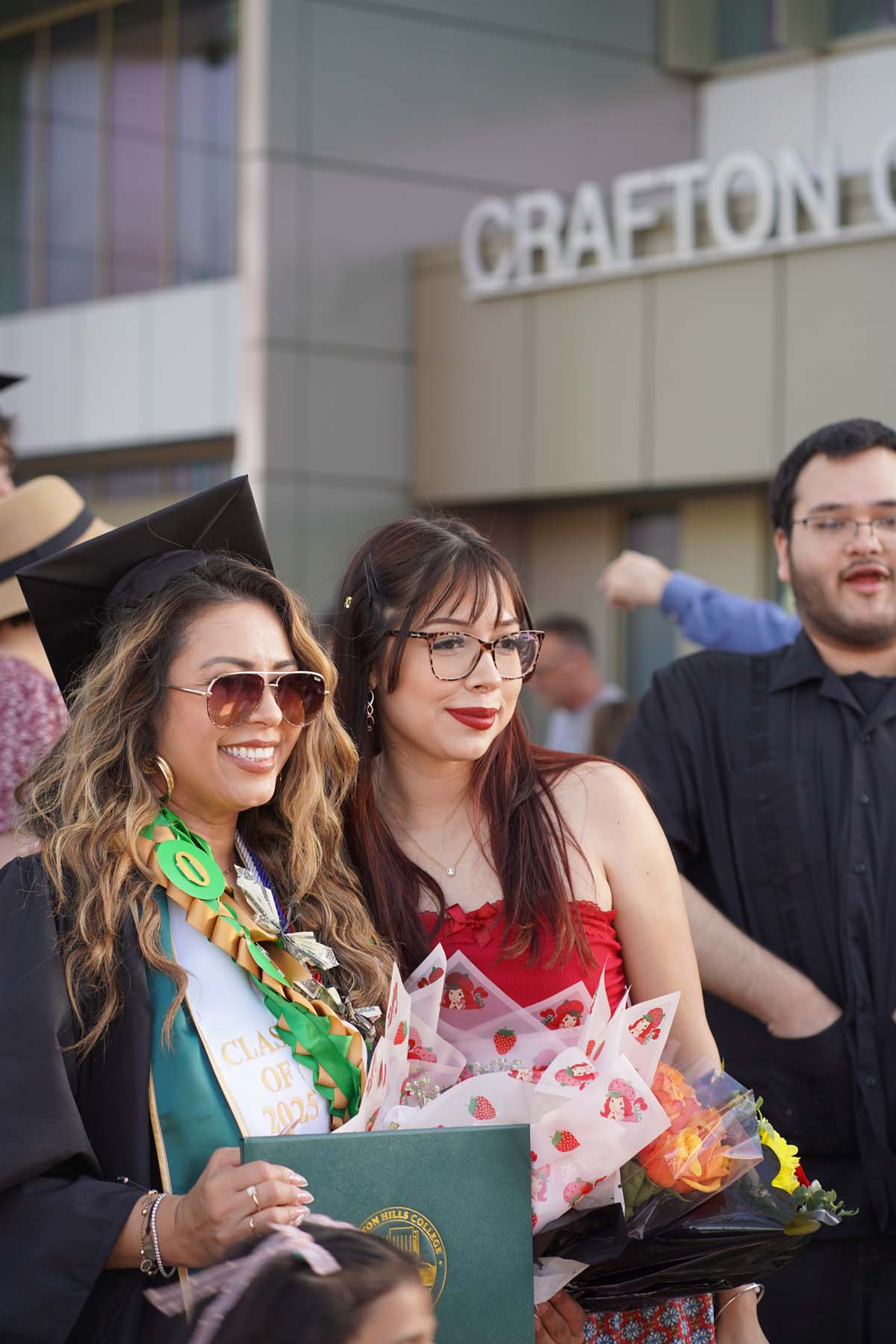 Grad recession at Commencement 2025 and pictures with family members.