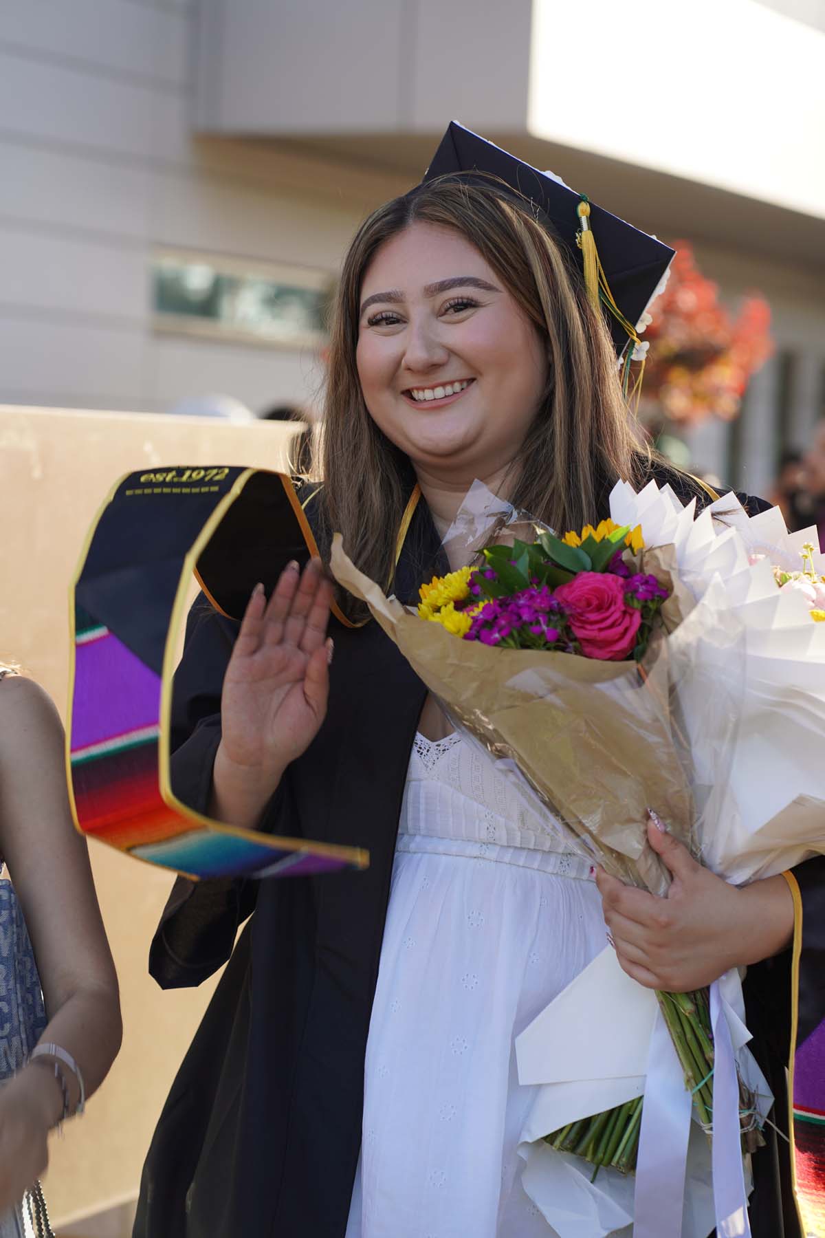 Grad recession at Commencement 2025 and pictures with family members.