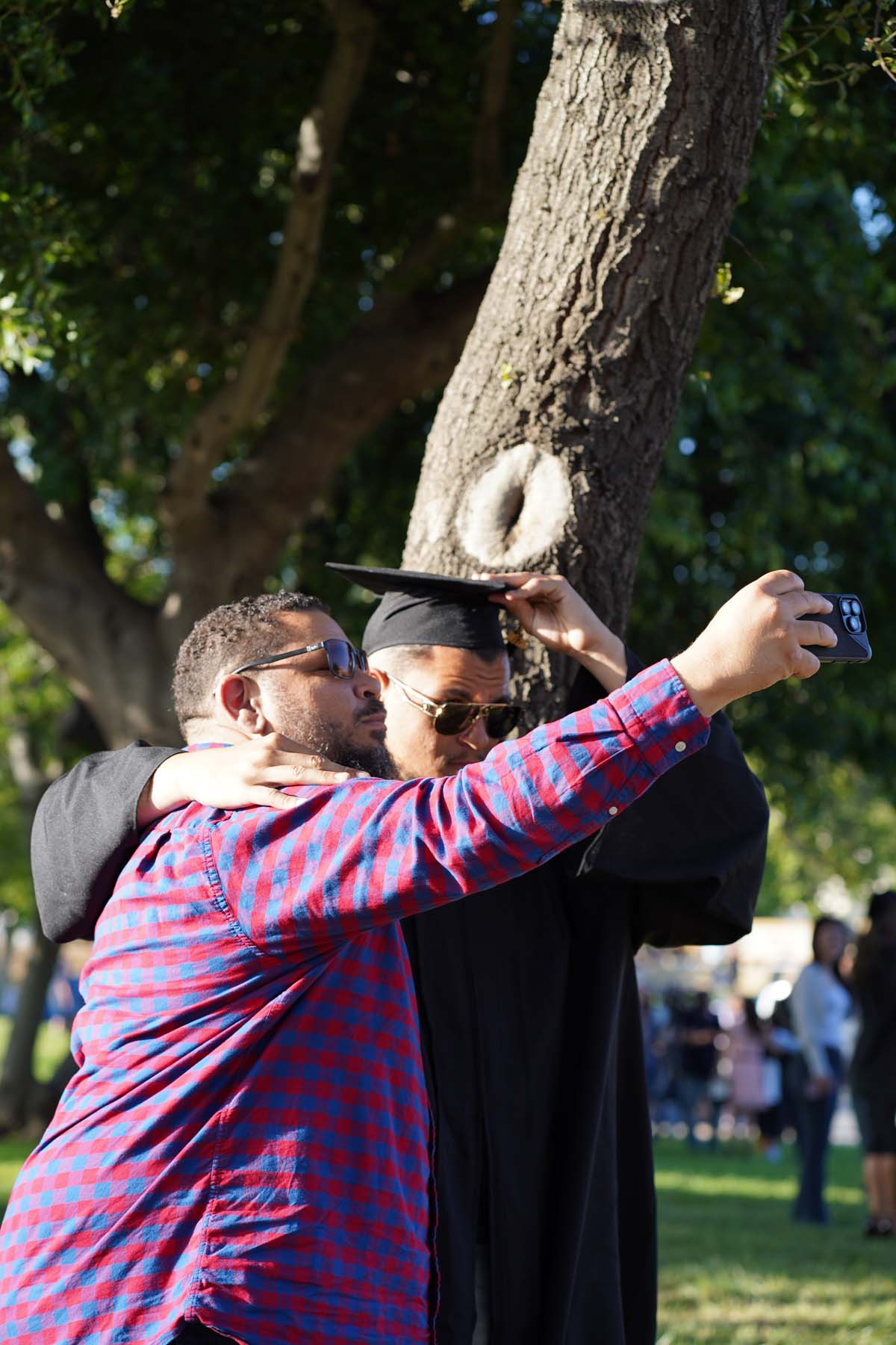 Grad recession at Commencement 2025 and pictures with family members.