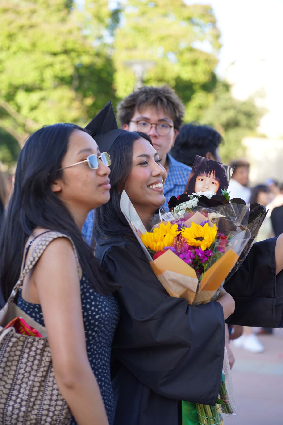 Grad recession at Commencement 2025 and pictures with family members.