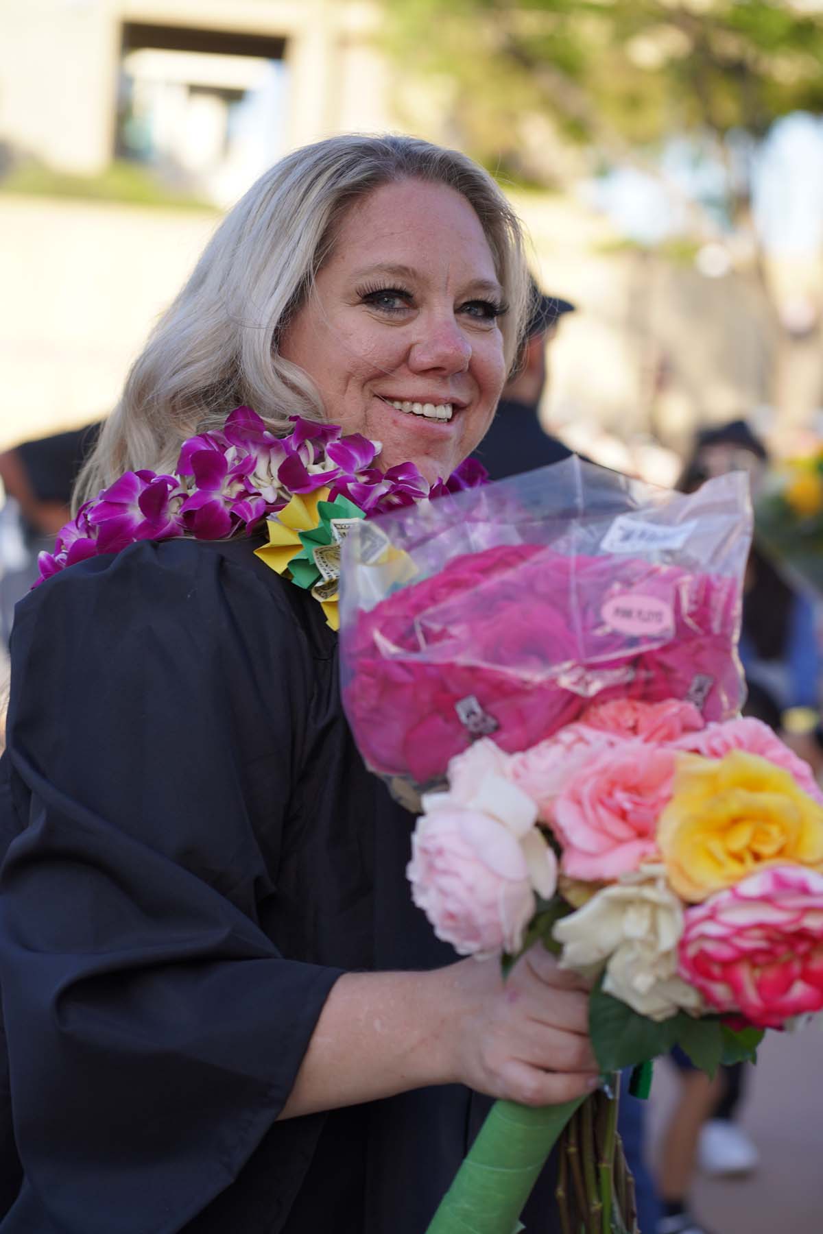 Grad recession at Commencement 2025 and pictures with family members.