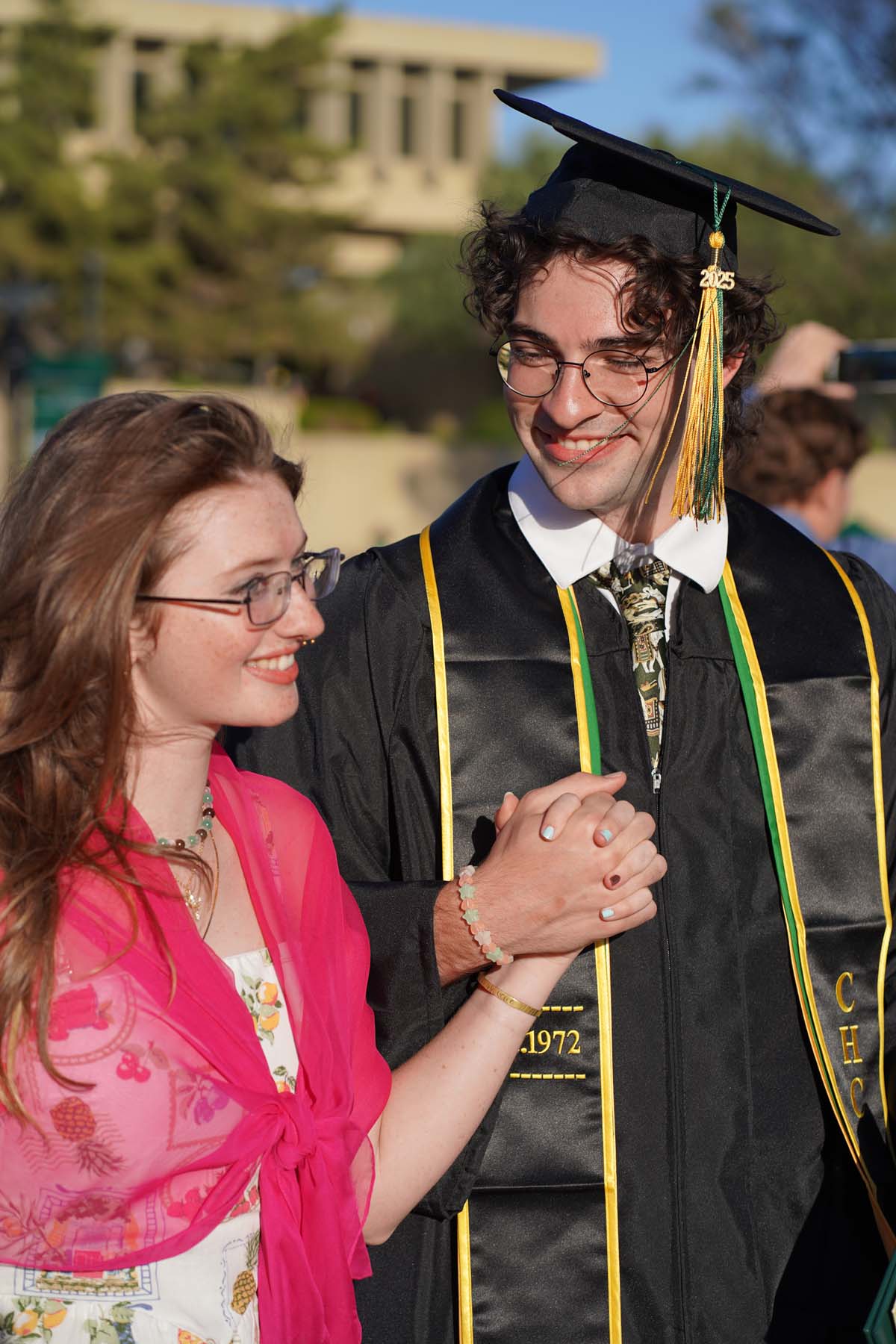 Grad recession at Commencement 2025 and pictures with family members.