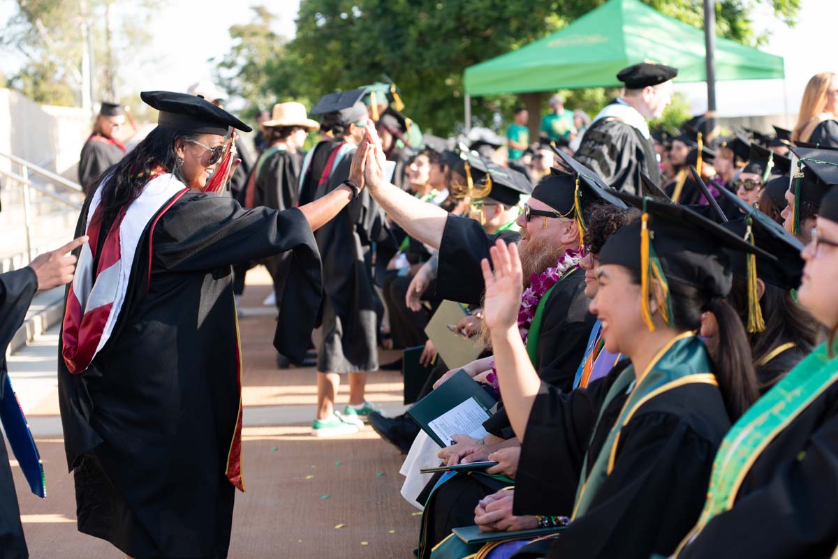 Grad recession at Commencement 2025 and pictures with family members.