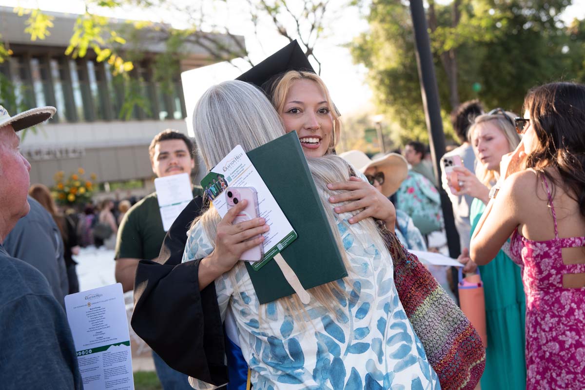 Grad recession at Commencement 2025 and pictures with family members.