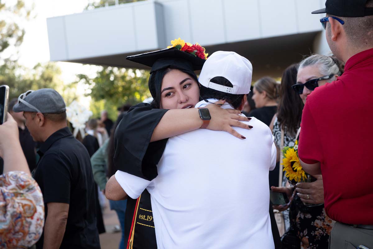 Grad recession at Commencement 2025 and pictures with family members.