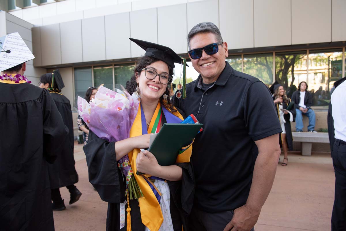 Grad recession at Commencement 2025 and pictures with family members.