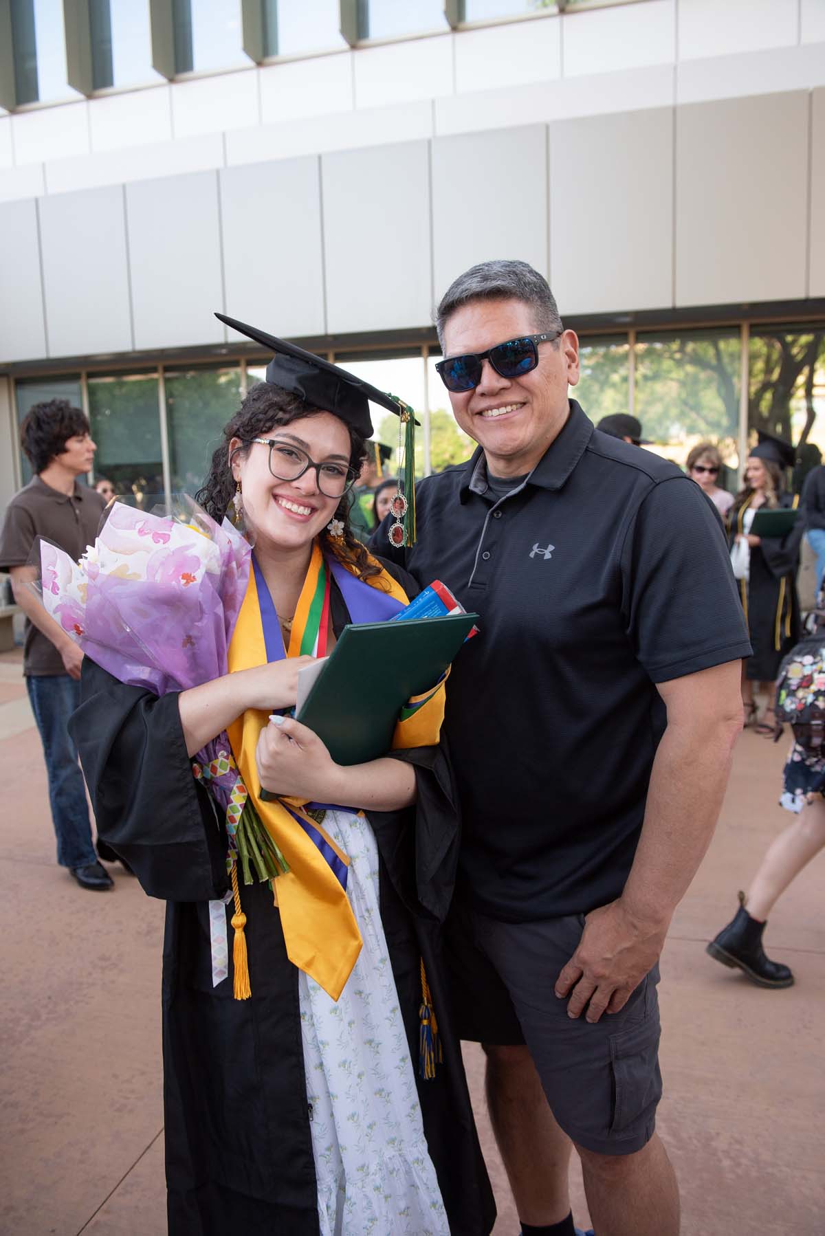Grad recession at Commencement 2025 and pictures with family members.