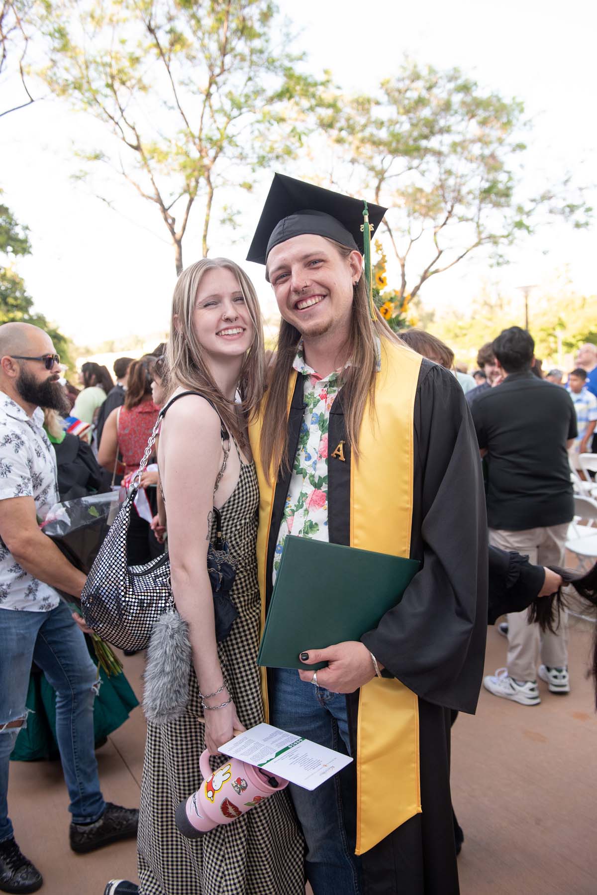 Grad recession at Commencement 2025 and pictures with family members.