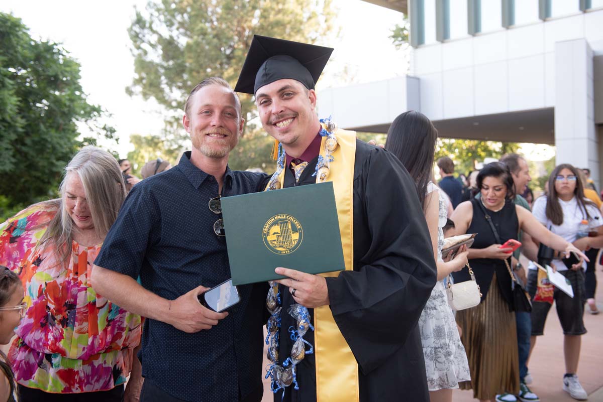 Grad recession at Commencement 2025 and pictures with family members.