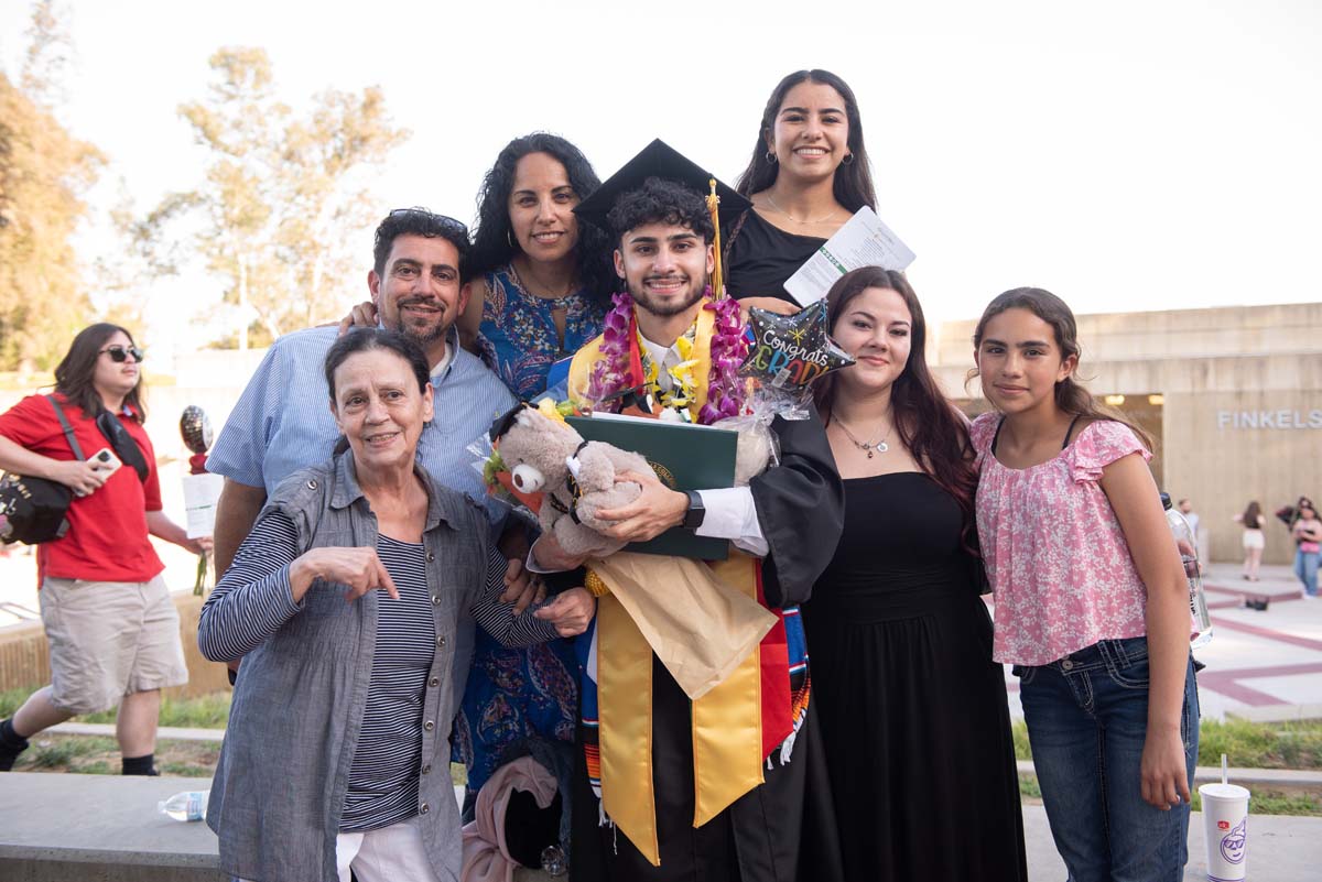 Grad recession at Commencement 2025 and pictures with family members.