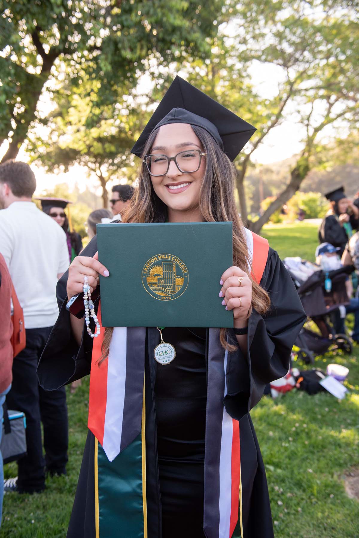 Grad recession at Commencement 2025 and pictures with family members.