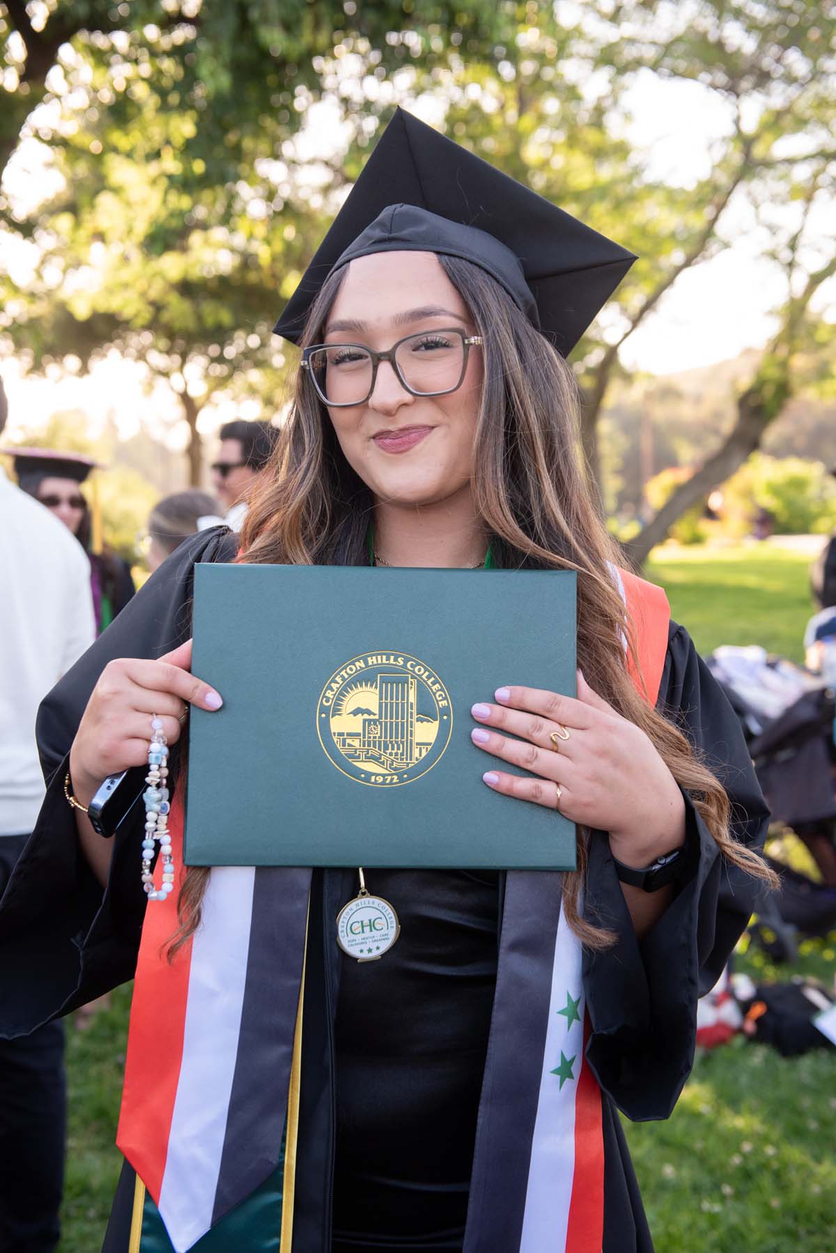 Grad recession at Commencement 2025 and pictures with family members.