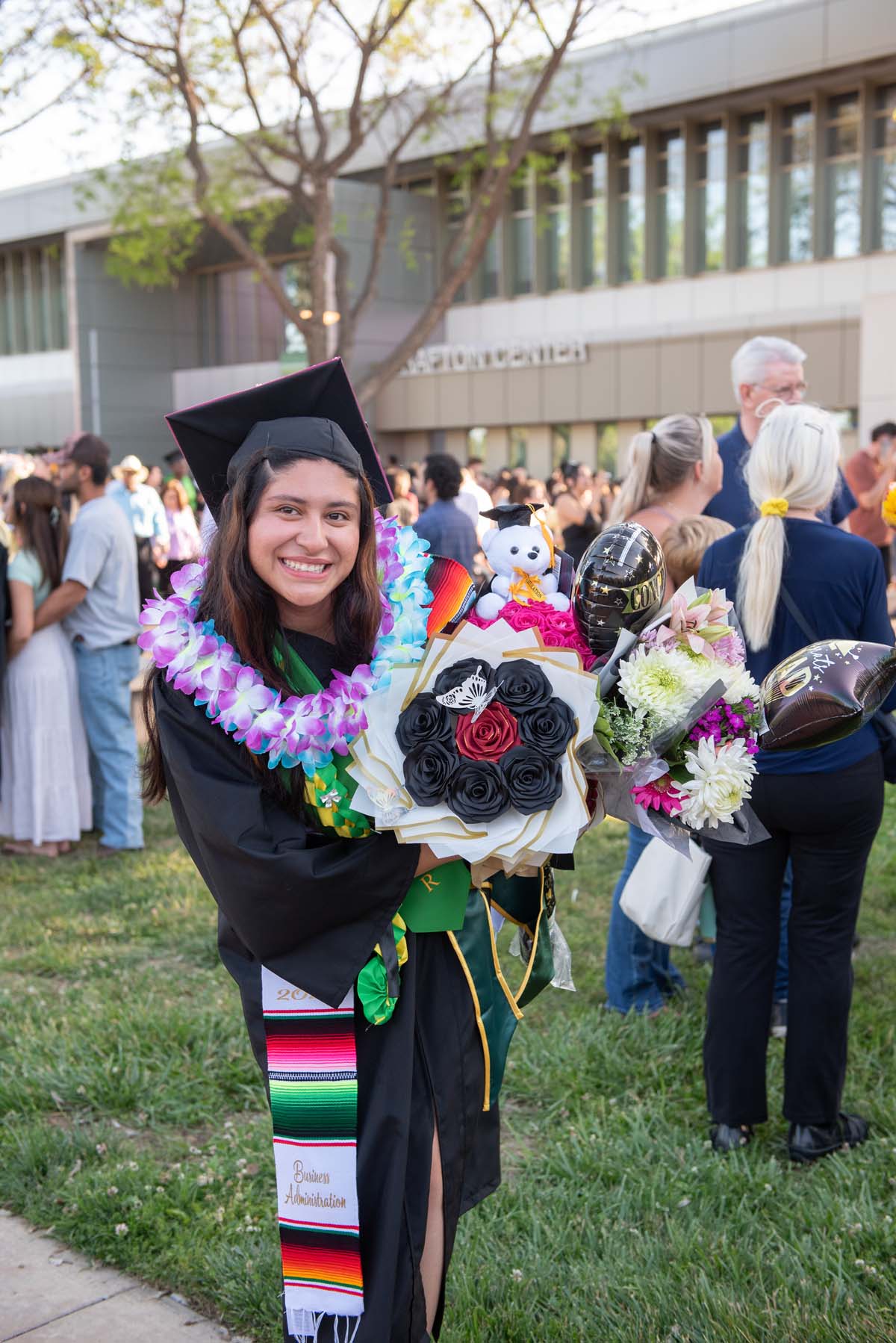 Grad recession at Commencement 2025 and pictures with family members.
