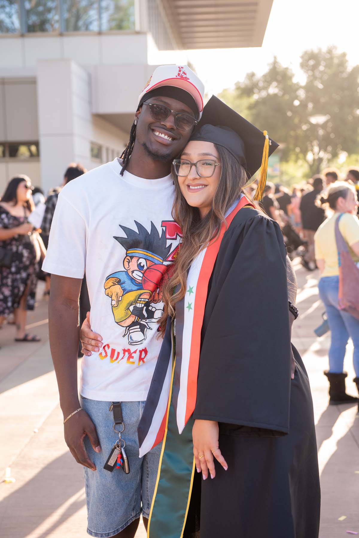 Grad recession at Commencement 2025 and pictures with family members.