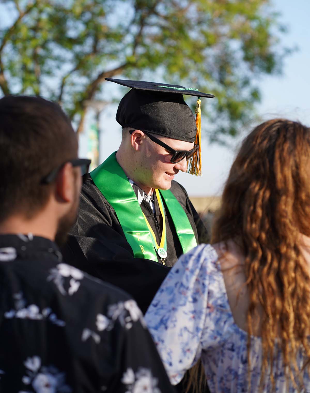 Grad recession at Commencement 2025 and pictures with family members.