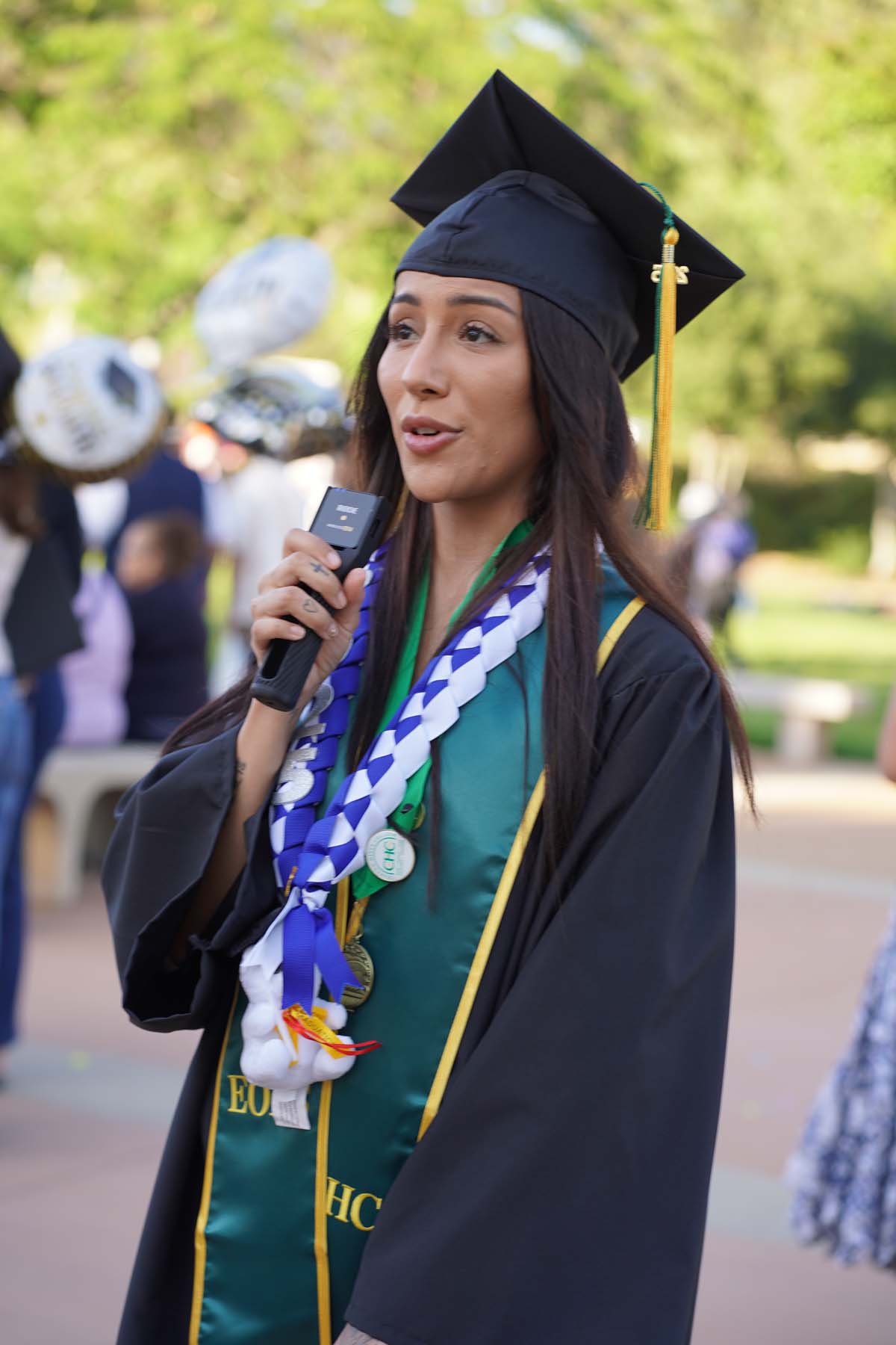 Grad recession at Commencement 2025 and pictures with family members.