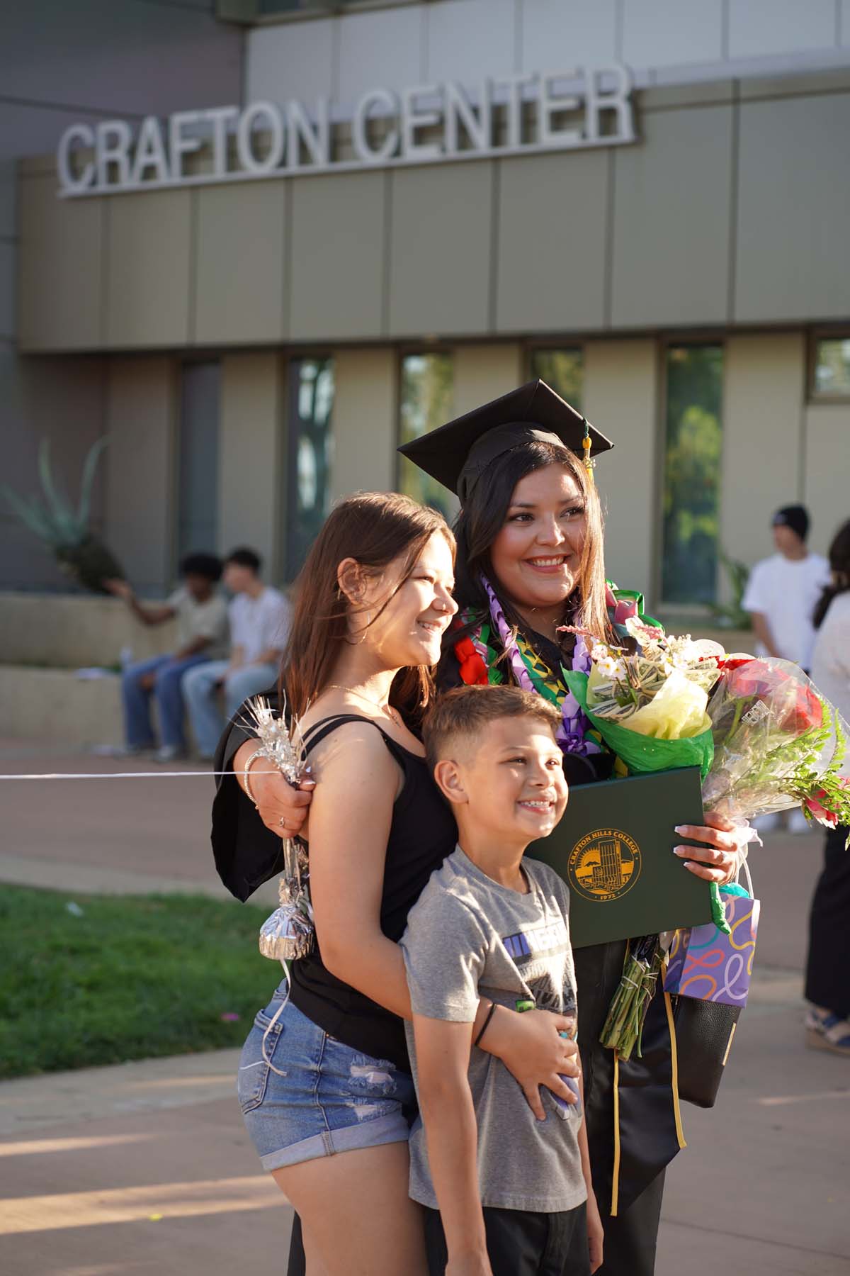 Grad recession at Commencement 2025 and pictures with family members.