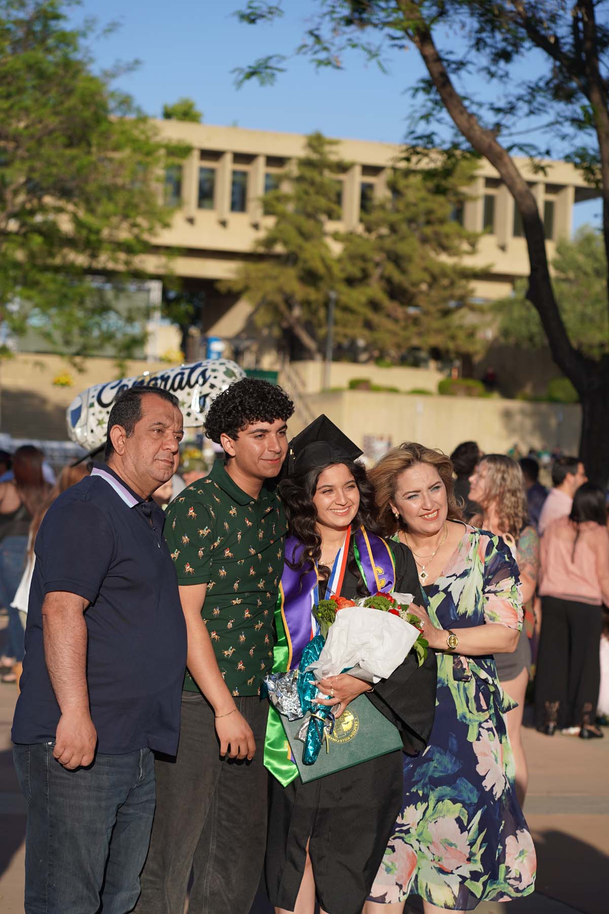 Grad recession at Commencement 2025 and pictures with family members.